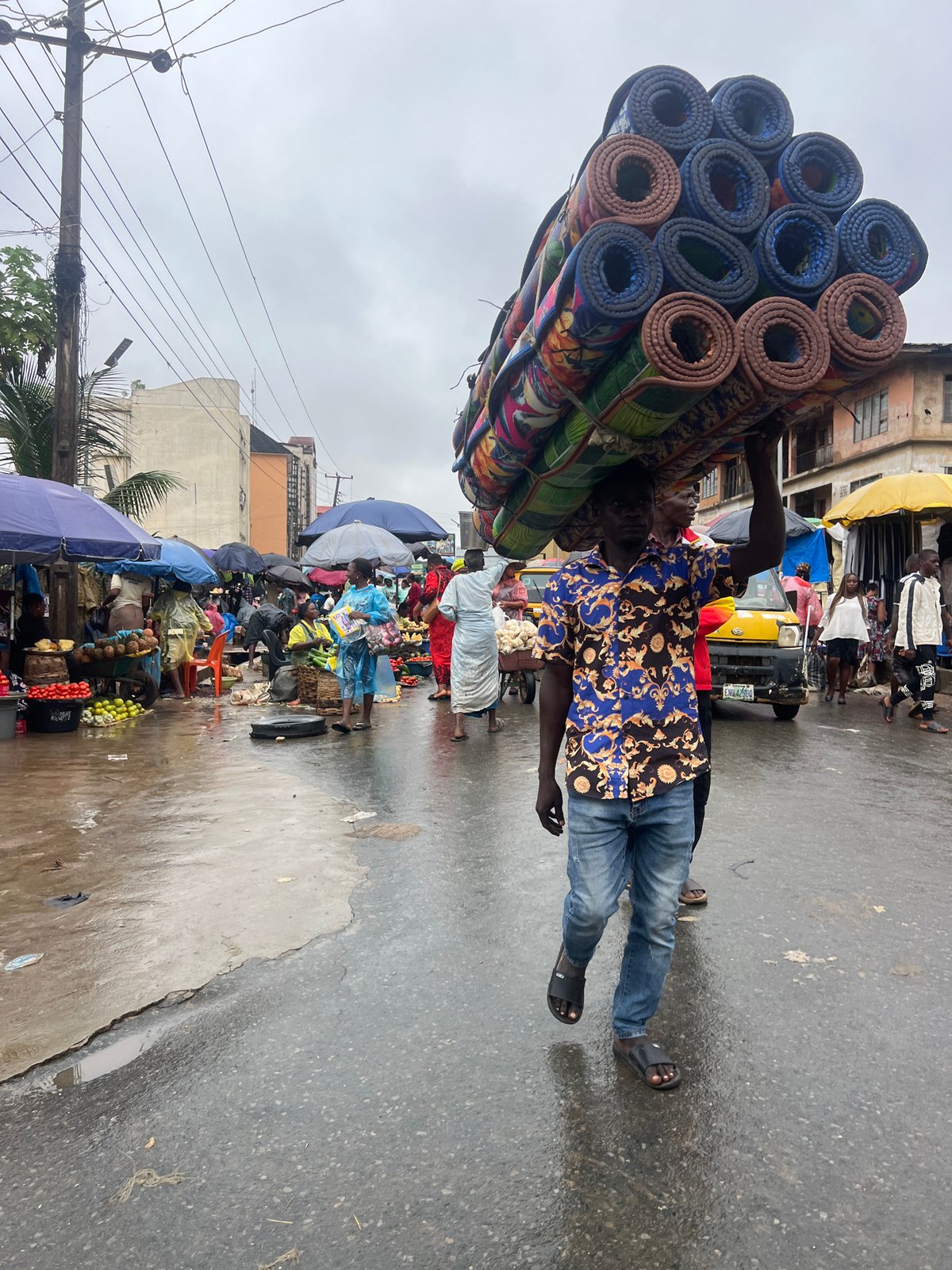 Onitsha market day keeps moving through the rain