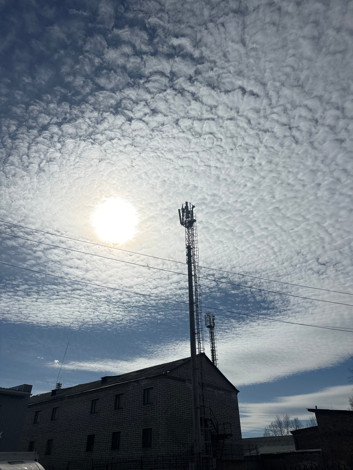 Morning clouds observed over Krasnoyarsk with cellular tower visible