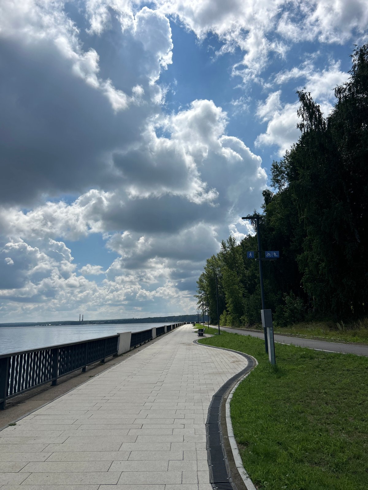 Waterfront promenade curves along the river in Chaikovsky