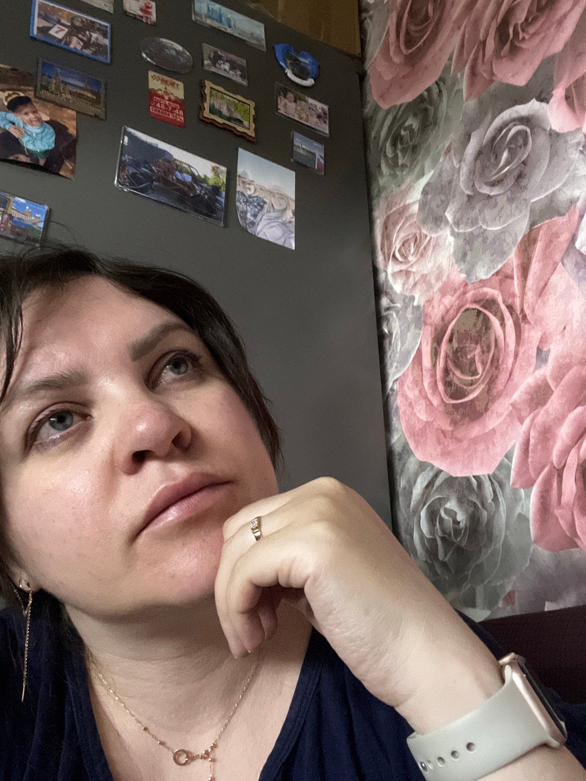 Woman photographed against decorated wall in Noviy, Russia