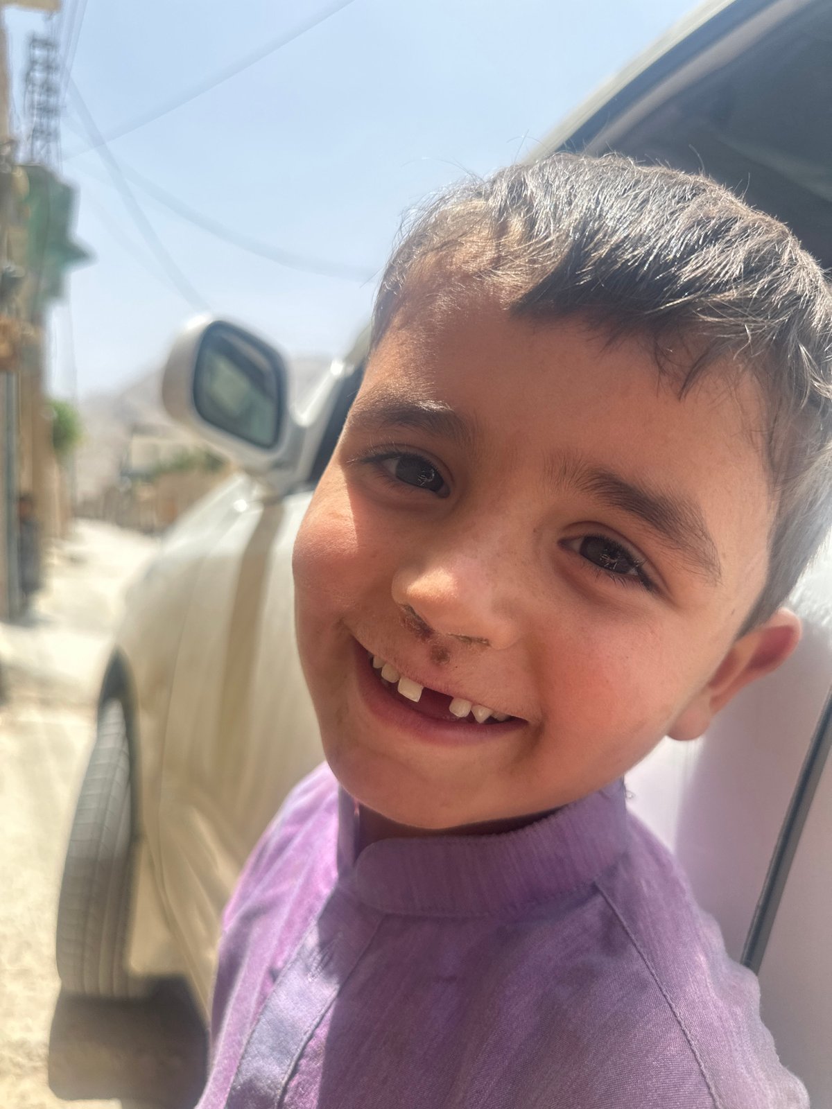Big smile, missing tooth — a portrait from Quetta, Pakistan