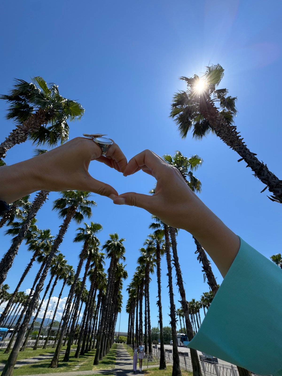 Sunny selfies among palm trees in Sirius, Russia
