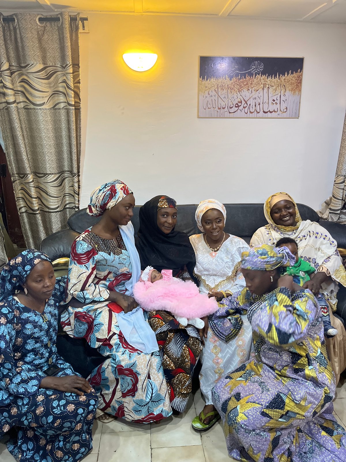 Traditional family celebration with newborn in Jos, Nigeria