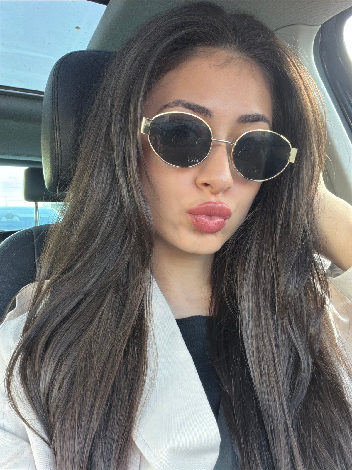 Woman in sunglasses observed in car in Sofia