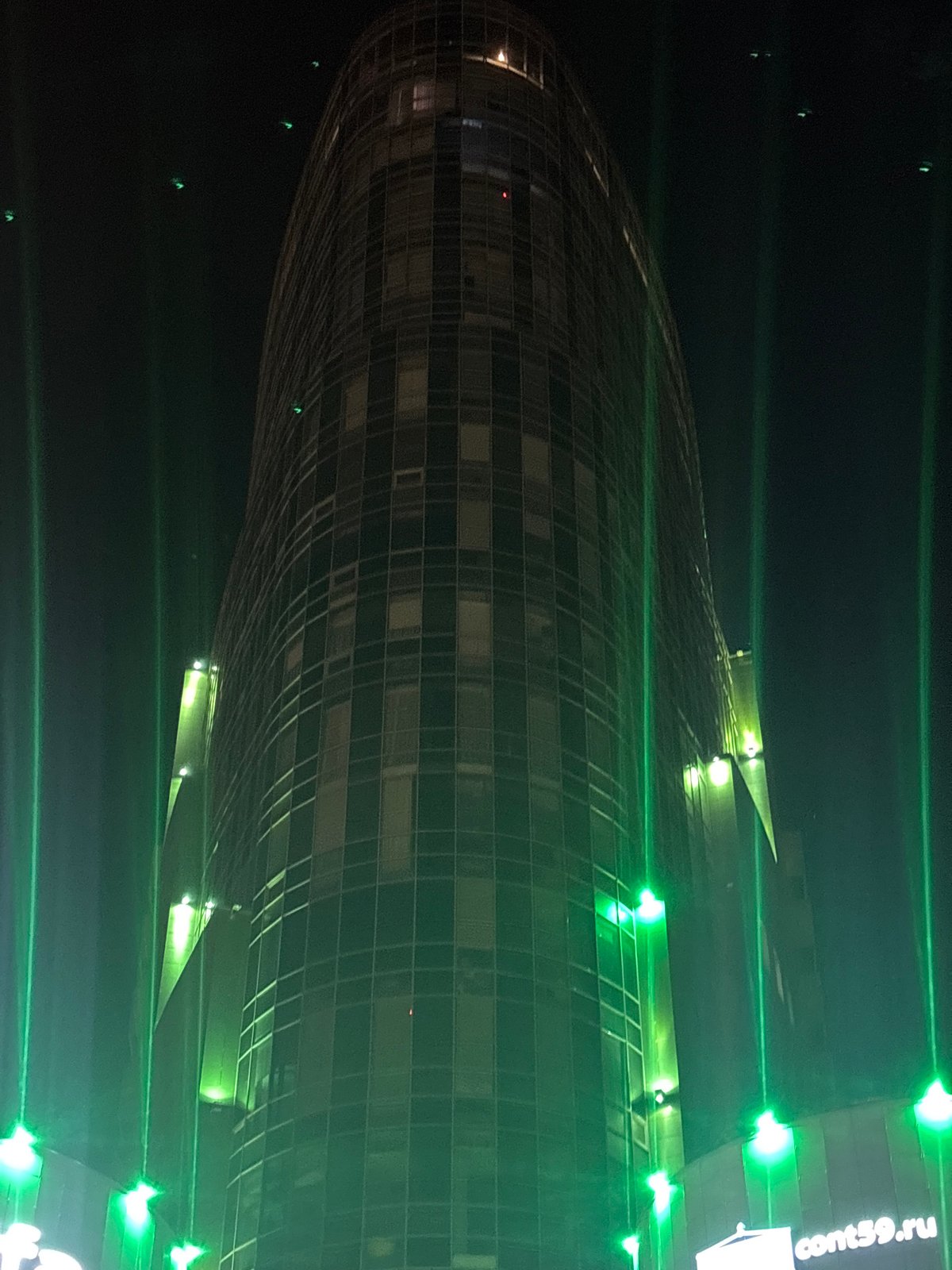 Night views of illuminated Green Plaza business center in Perm