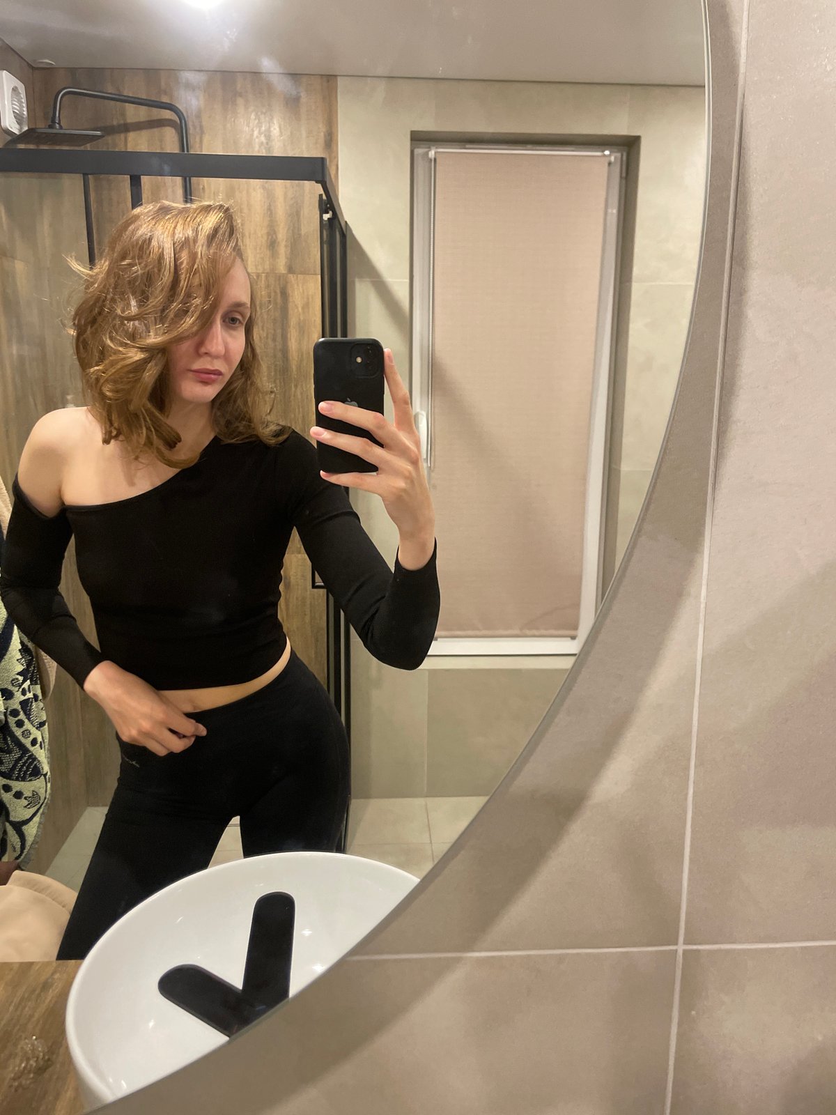 Woman takes bathroom mirror selfie in Russian forestry district