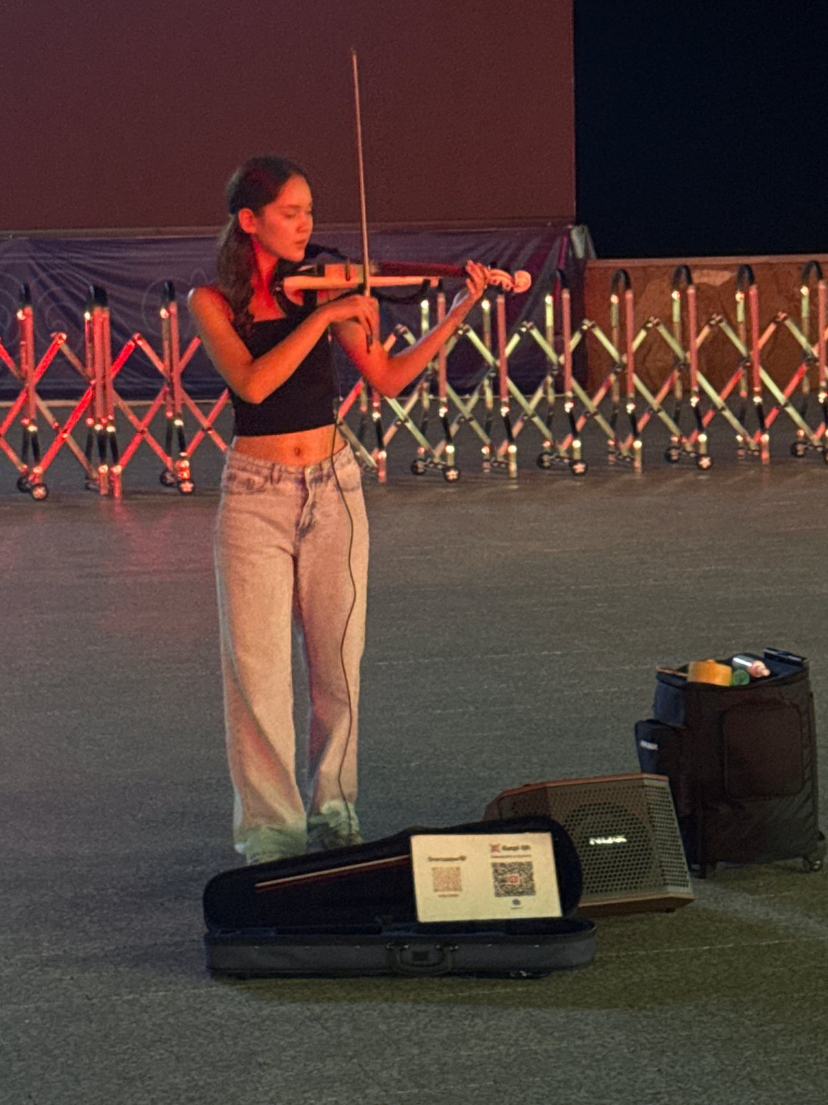 Live music and street performances at a Pavlodar evening event