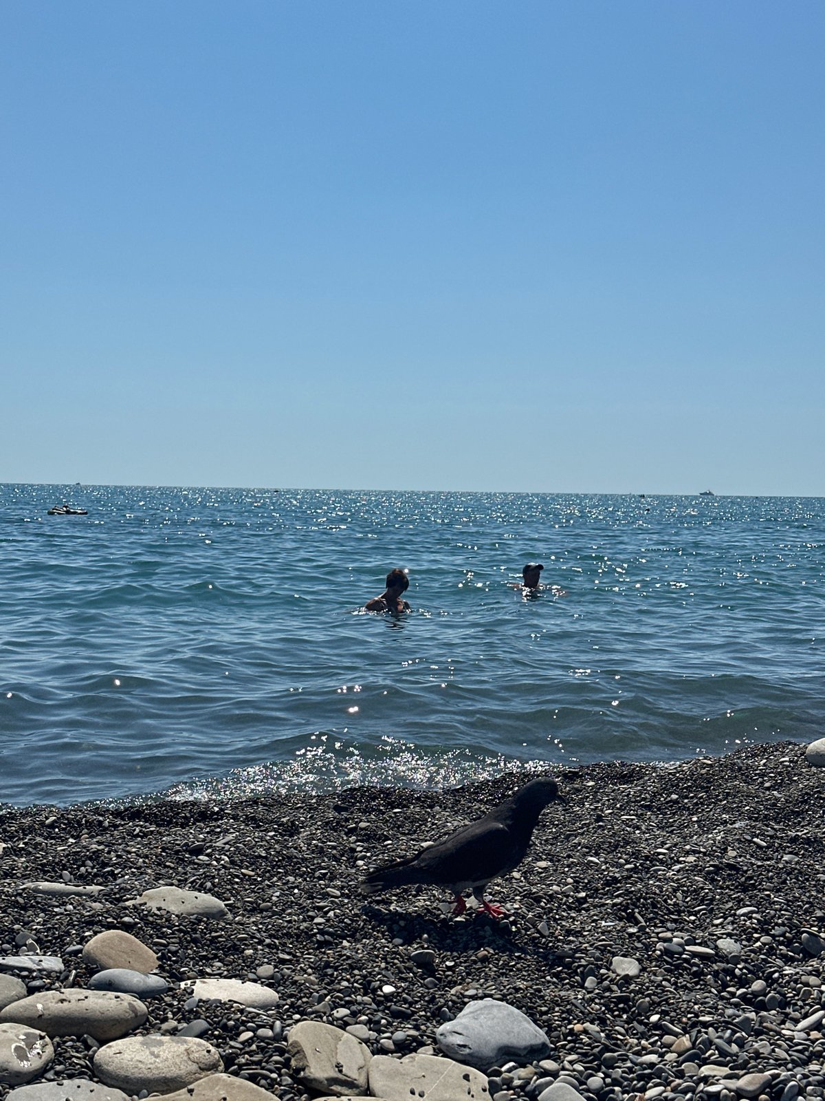 Lazy summer morning along Sochi's Black Sea pebble beach