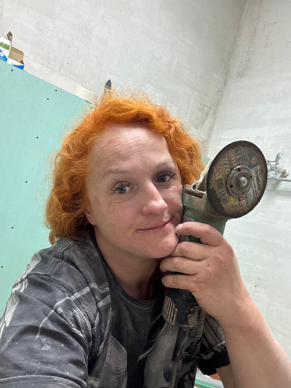 Woman performs renovation work with power tools in Chaikovsky