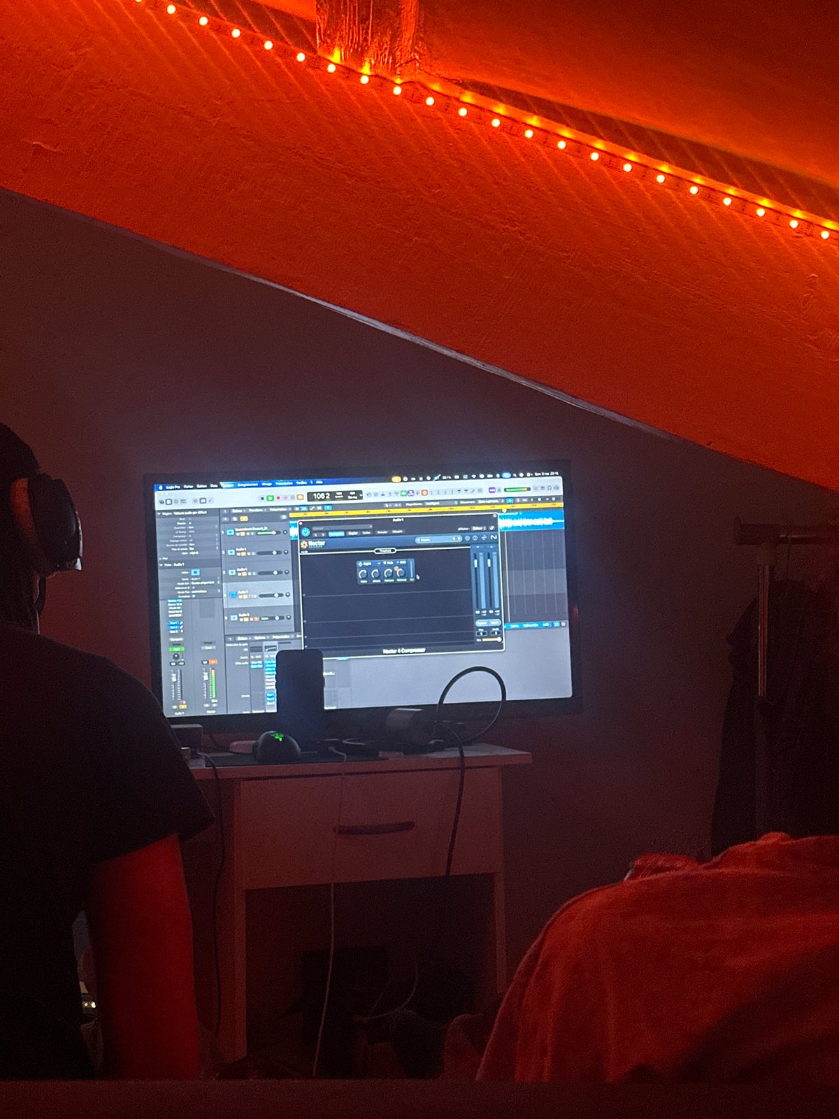 Music producer works late night session in Paris studio