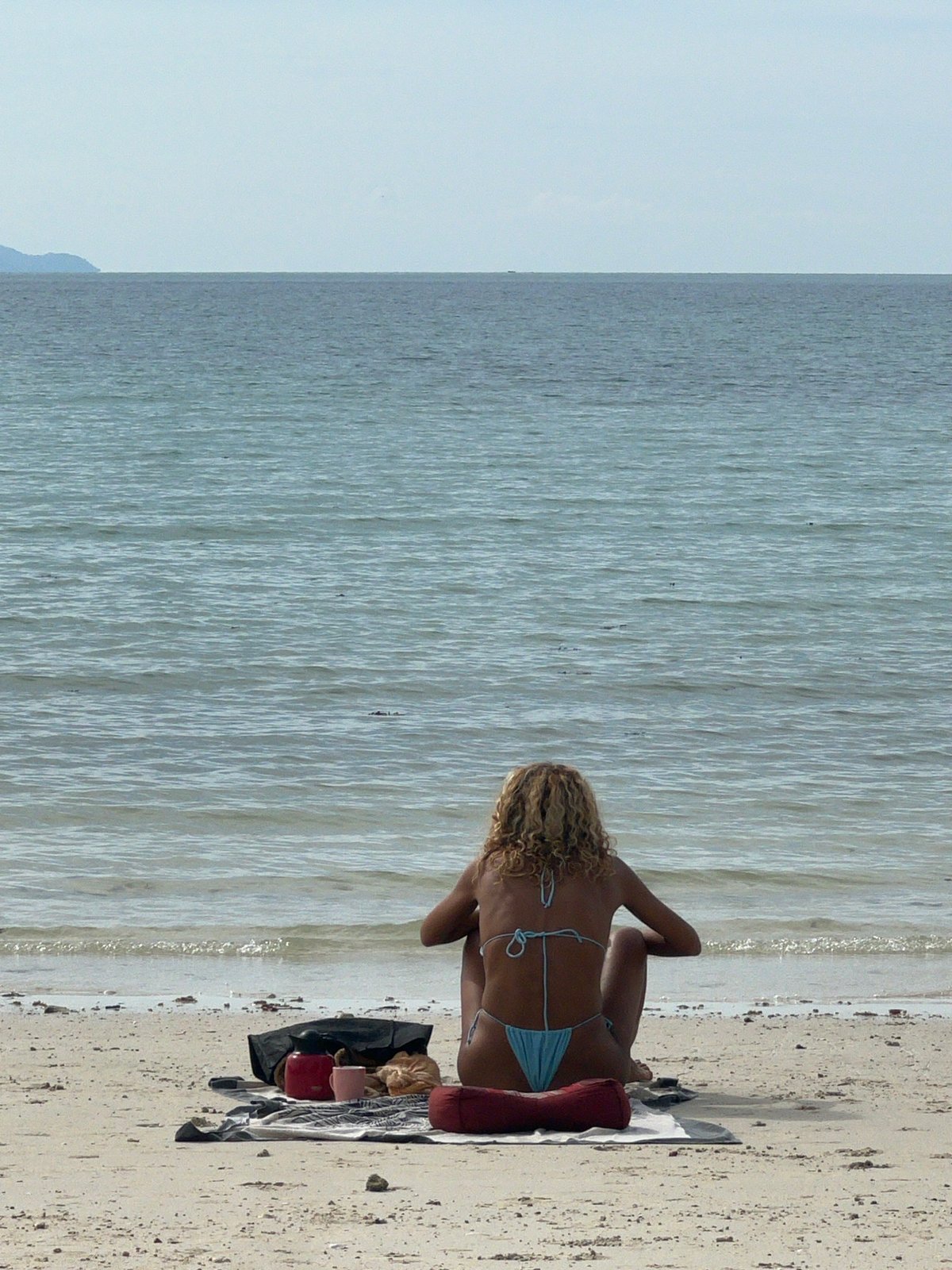 Koh Phangan beach morning: boats, murals, and shoreside life