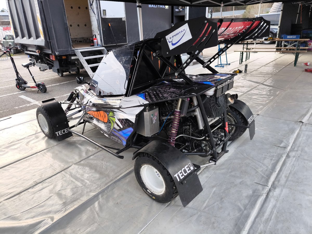 Off-road racing team stages vehicles in Riga lot
