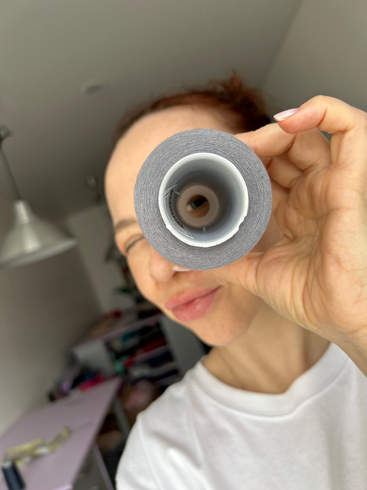 Woman takes selfies with crafting supplies in Chaikovsky apartment
