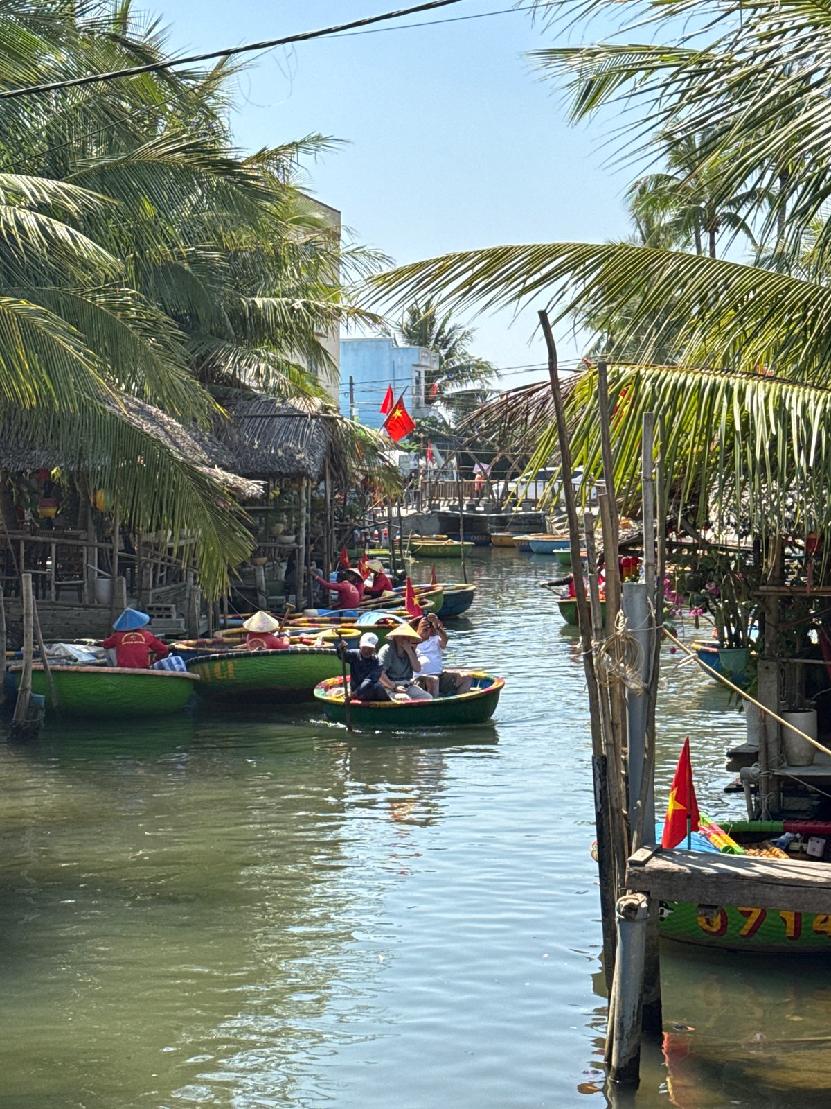Colorful traditional coracle boats docked in Đà Nẵng waterway