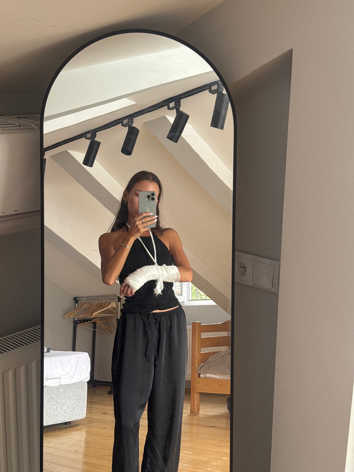 Tbilisi apartment, cast arm, mirror selfie and window view