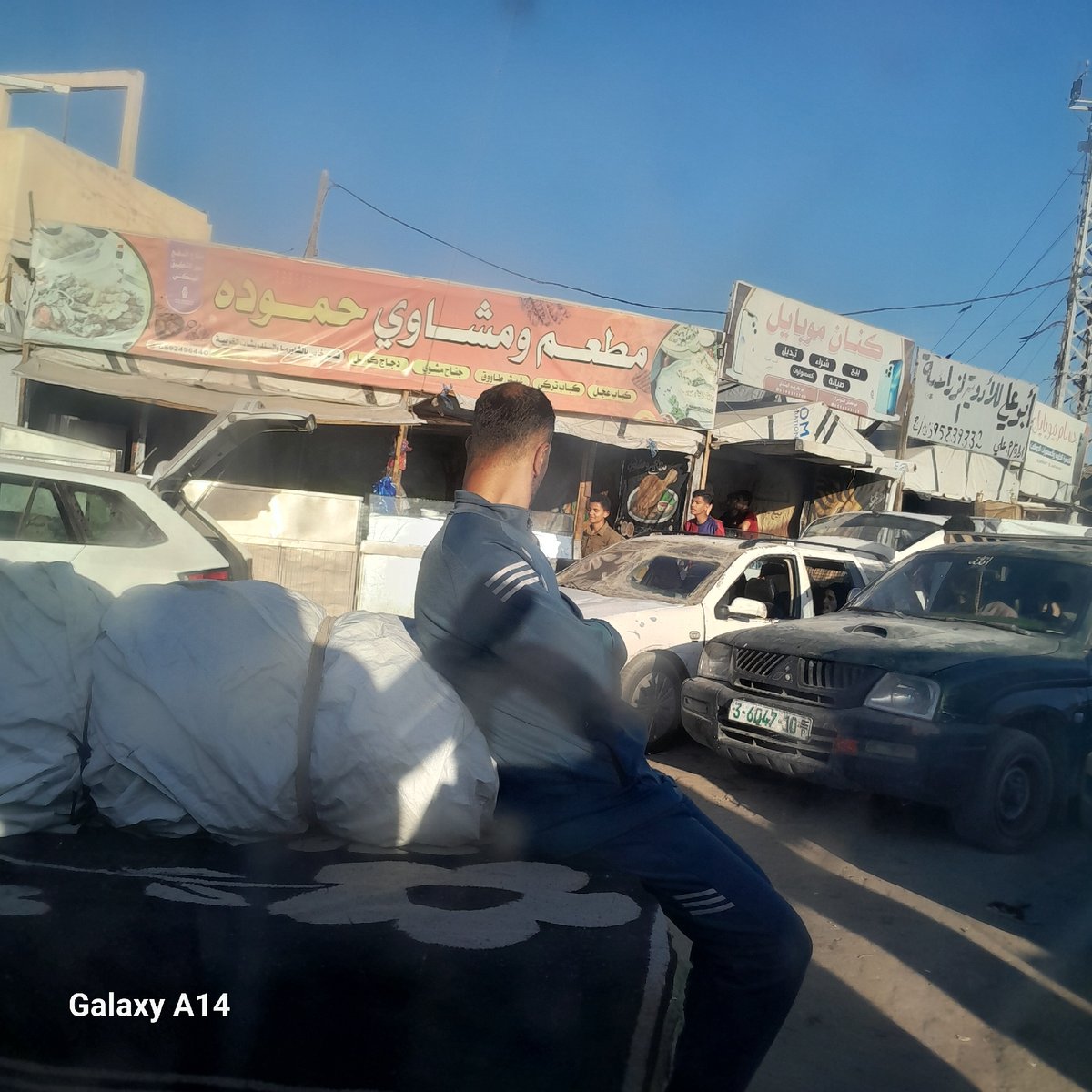 Daily life documented in Khan Yunis street markets and settlements