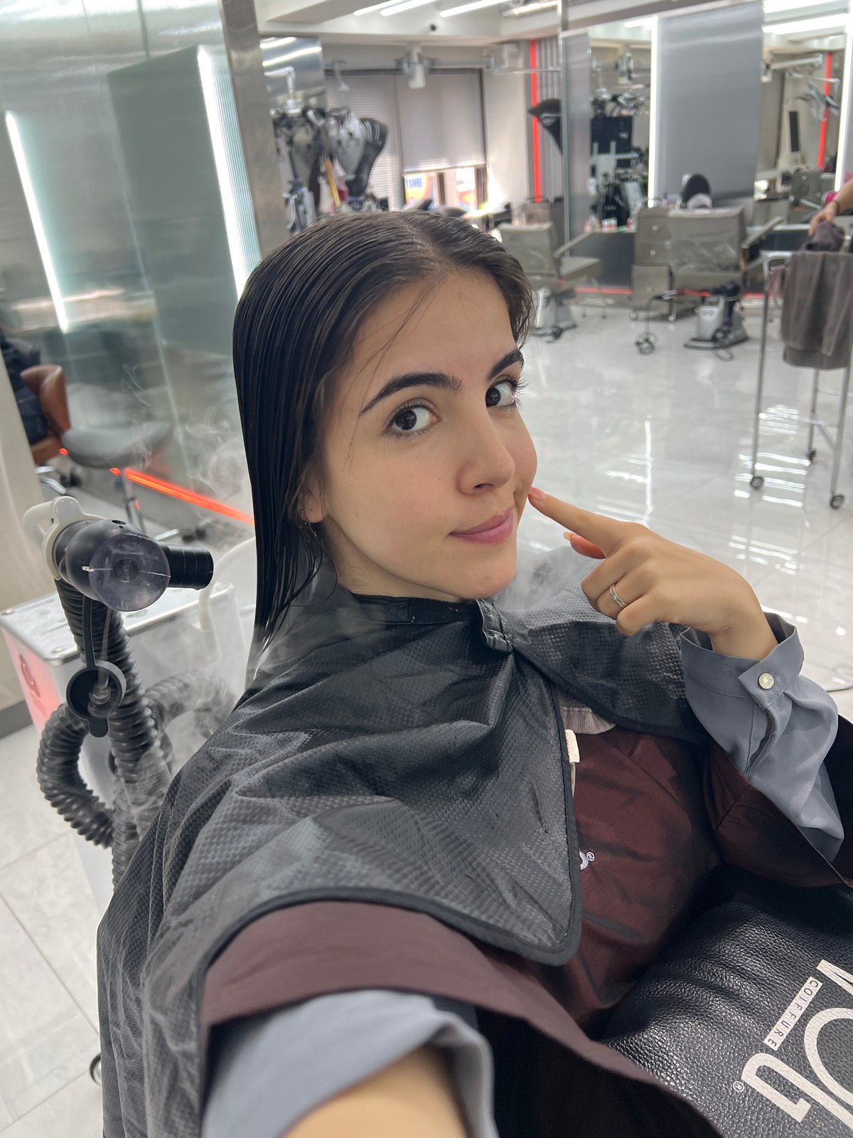 Woman receives hair treatment at Seoul salon early morning