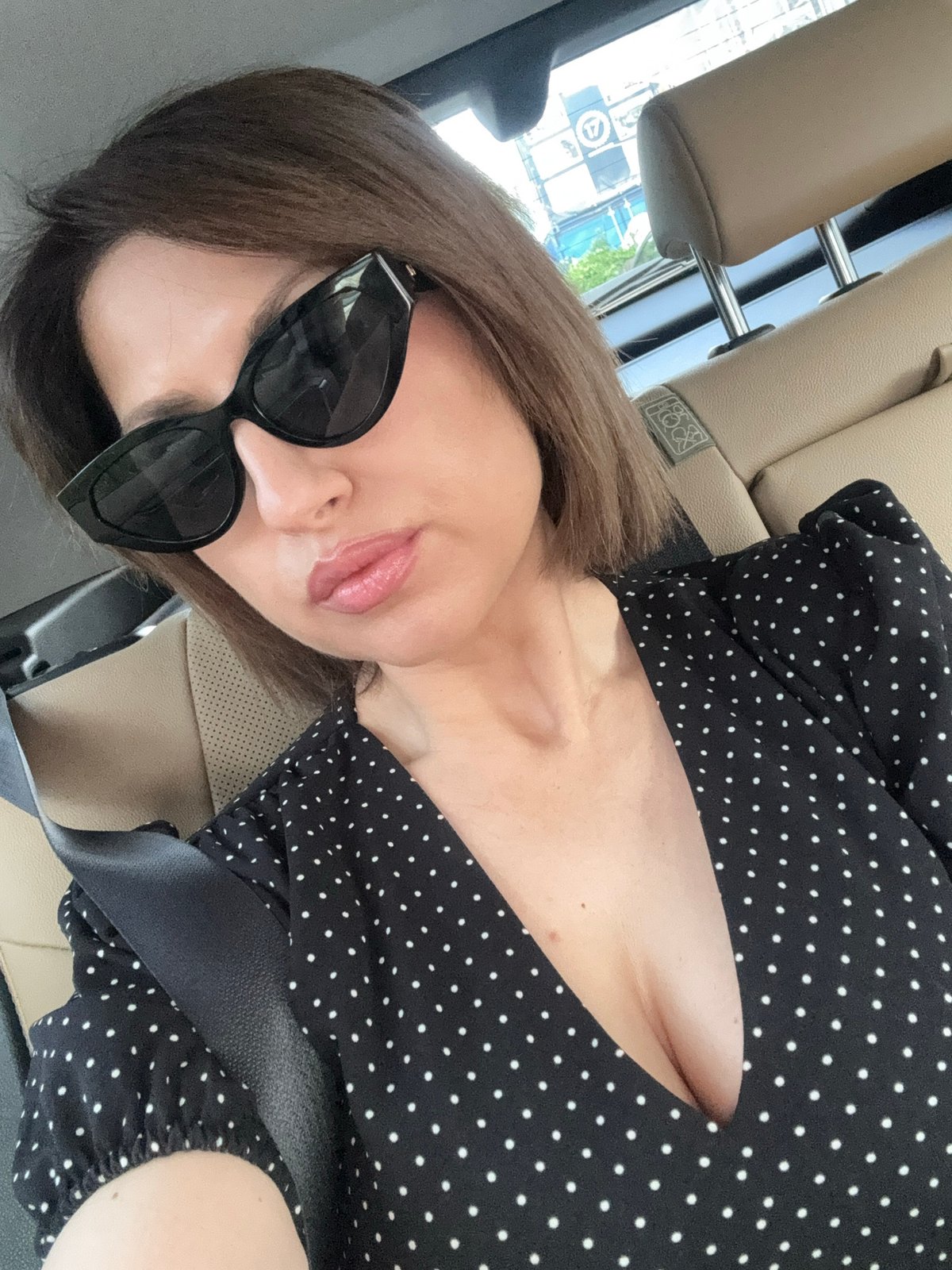 Woman takes early morning car selfies in Sofia