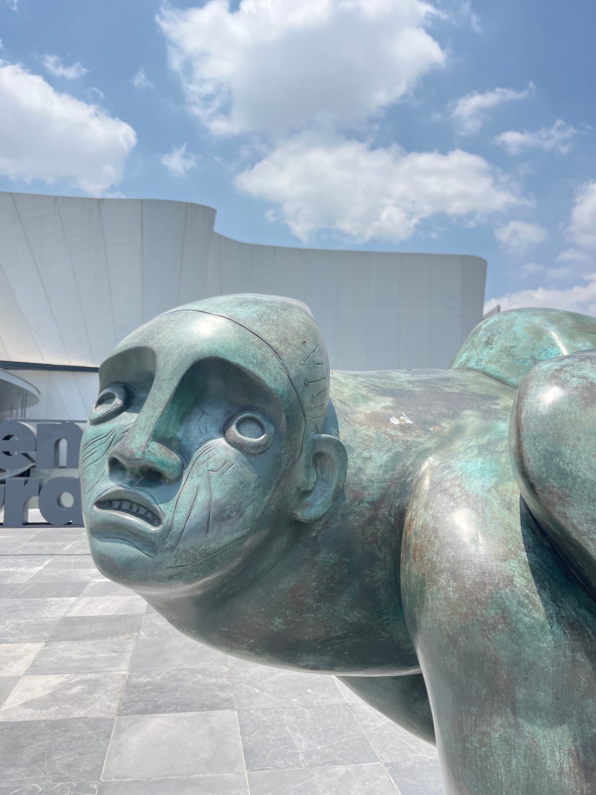Visitor documents baroque museum's modern architecture and bronze sculptures