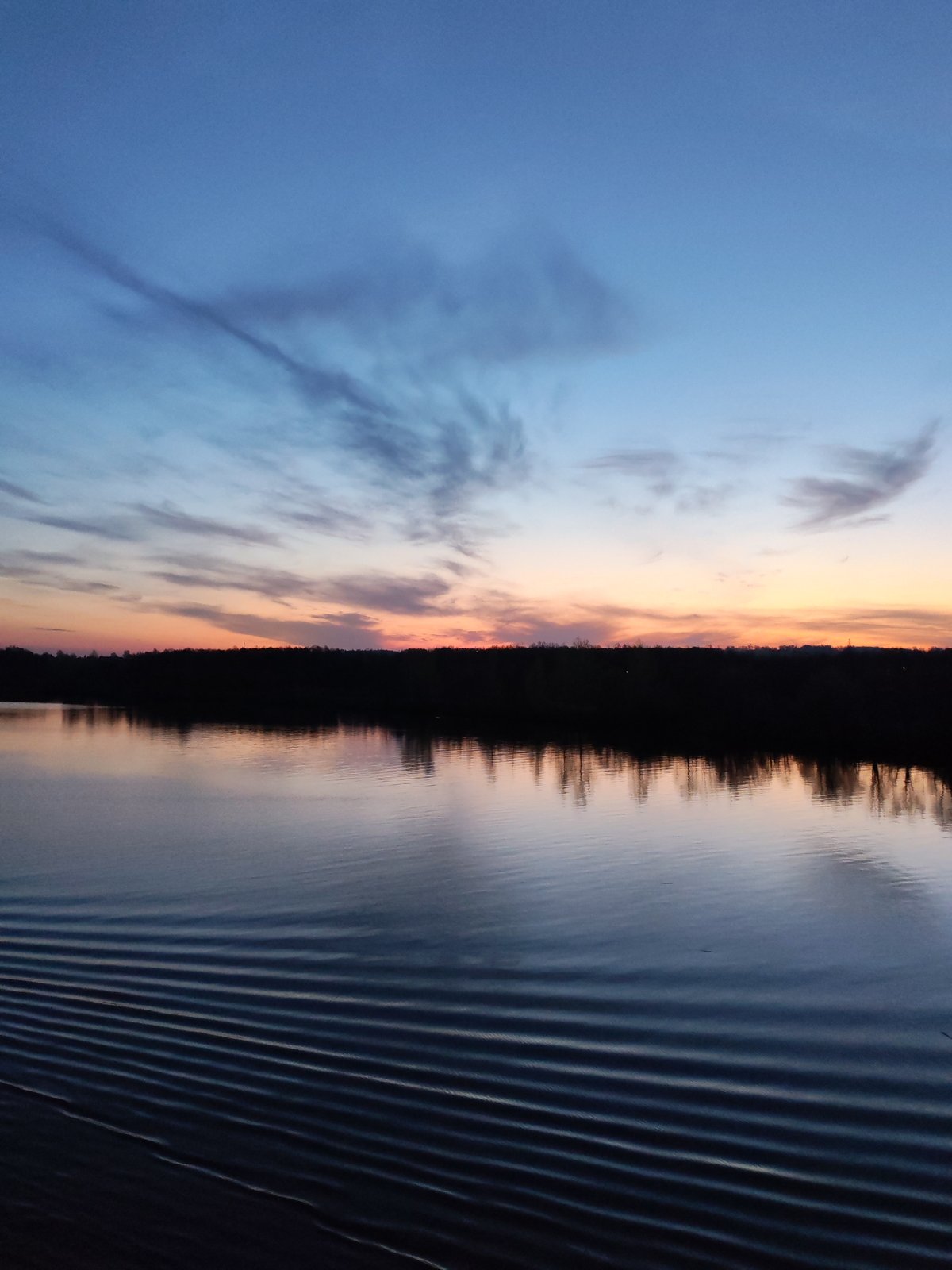 Witness documents peaceful river scene at dusk