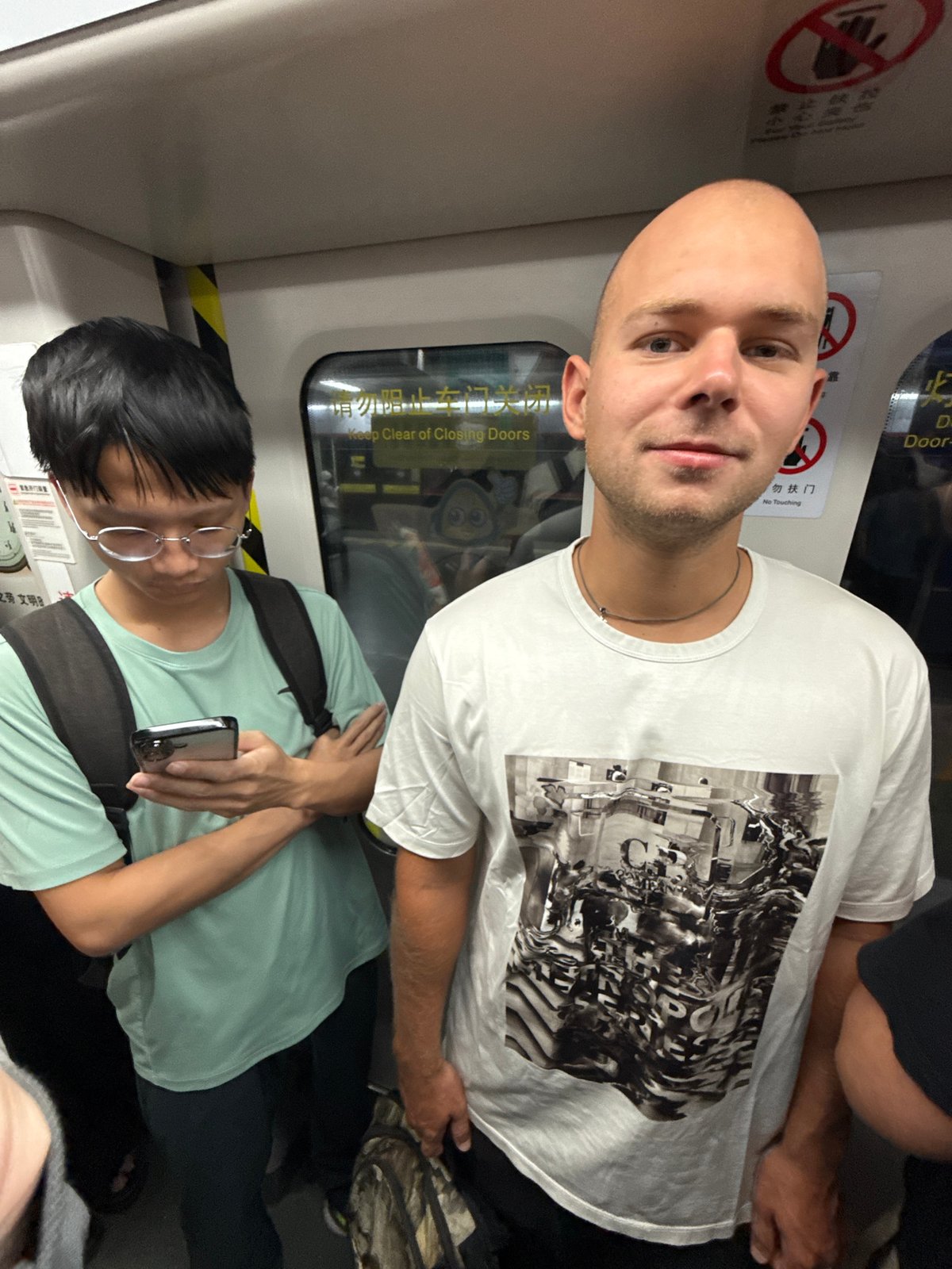 Late-night commuters ride crowded Guangzhou Metro in Tianhe District
