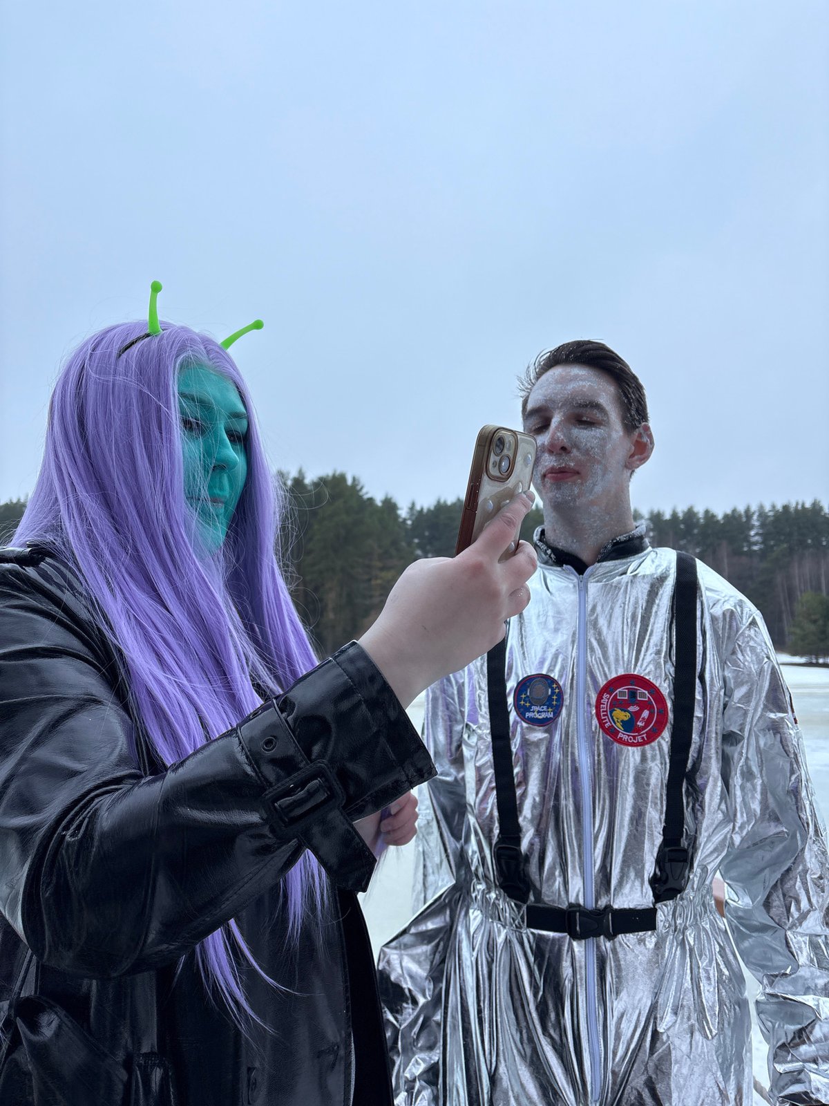 Costumed visitors document winter banya experience in Prikamskii, Russia