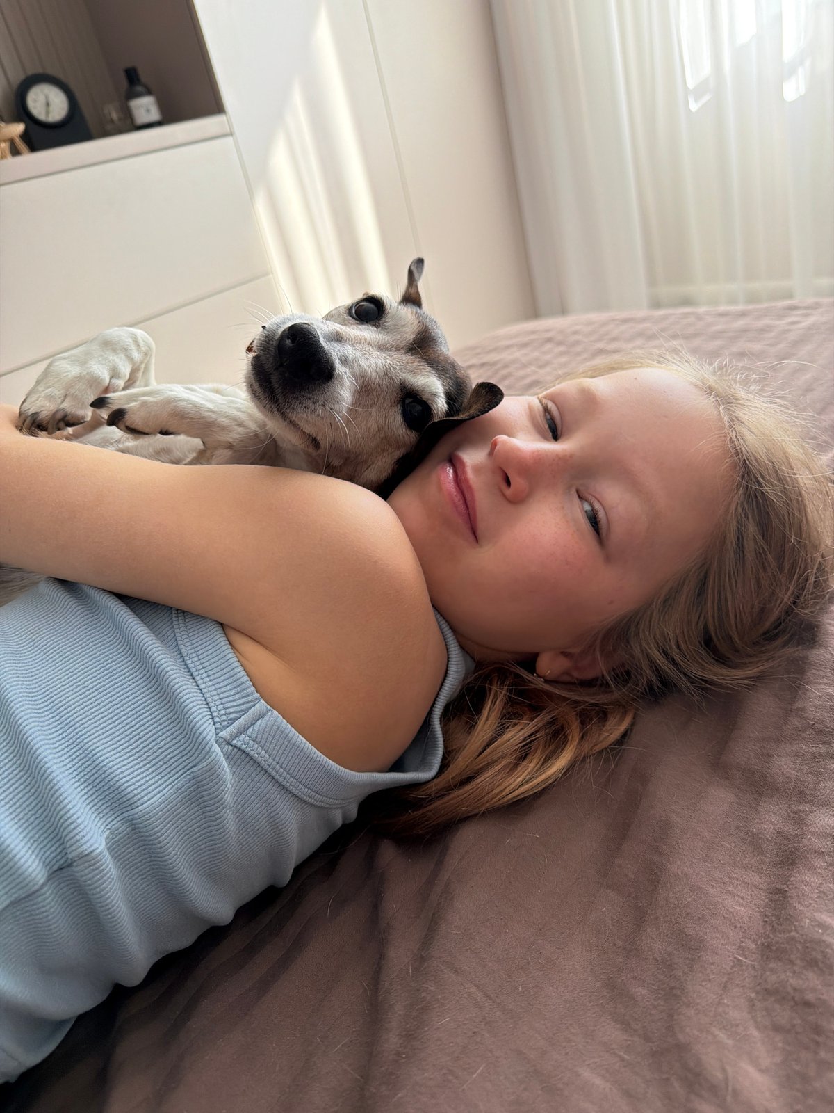 Girl and small dog observed in quiet Russian villages