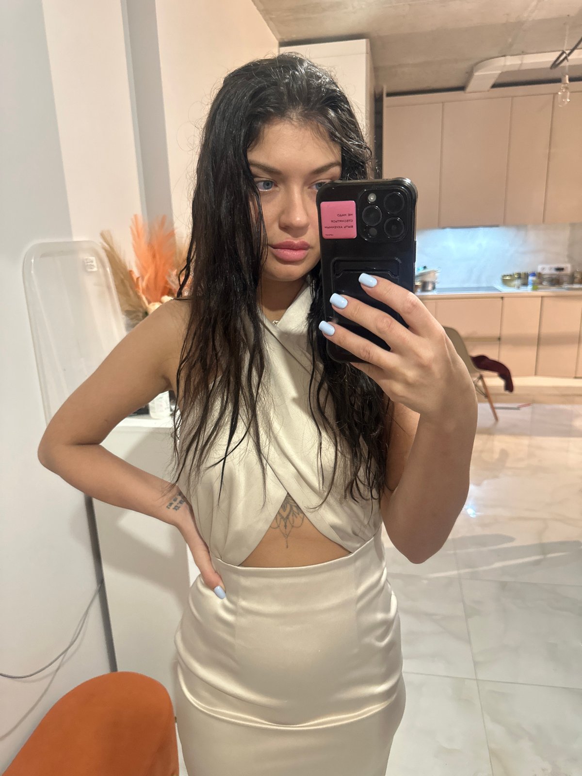 Woman takes mirror selfie at home in Khimki