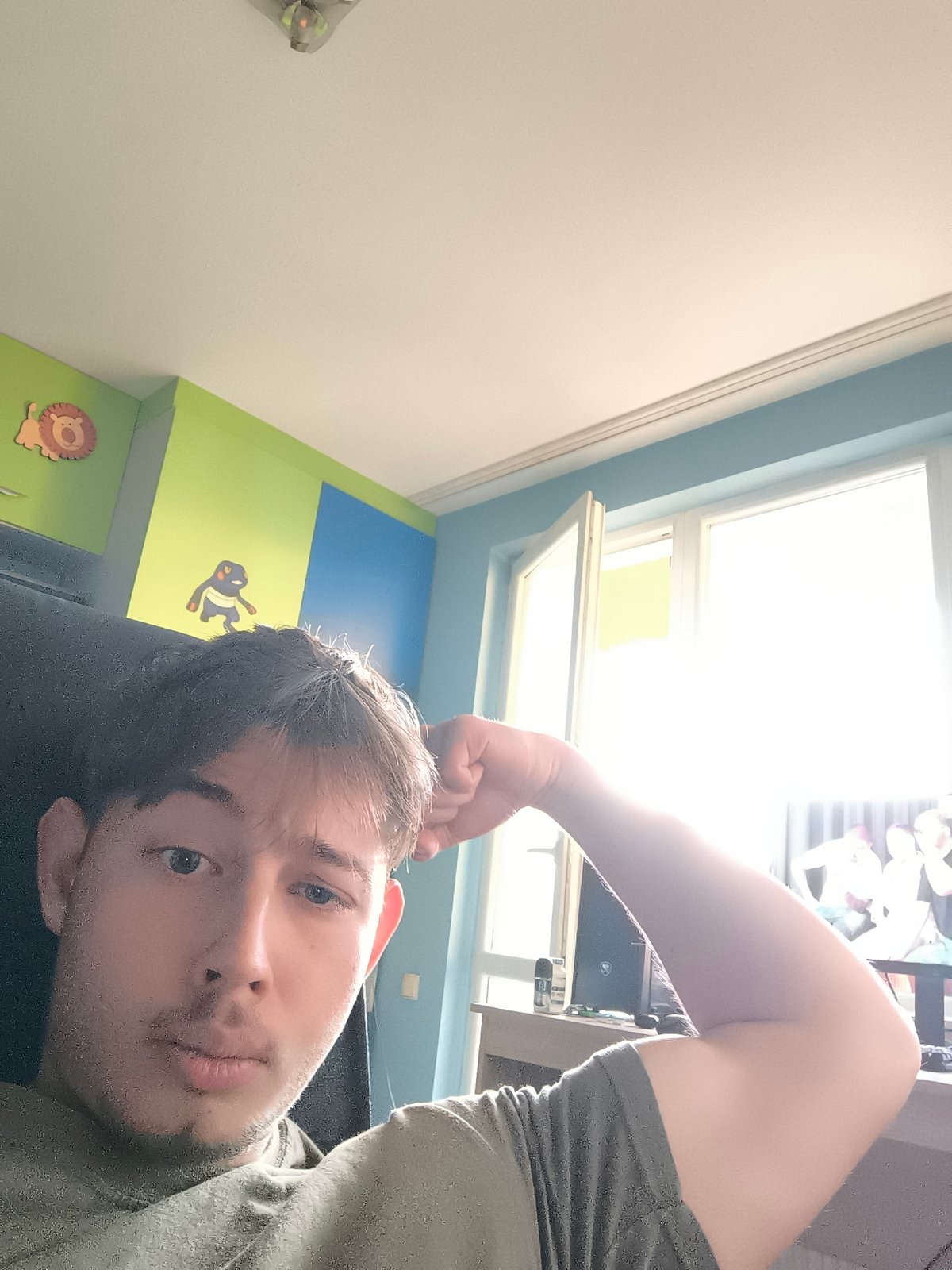 Young man takes selfies in Sofia indoor location