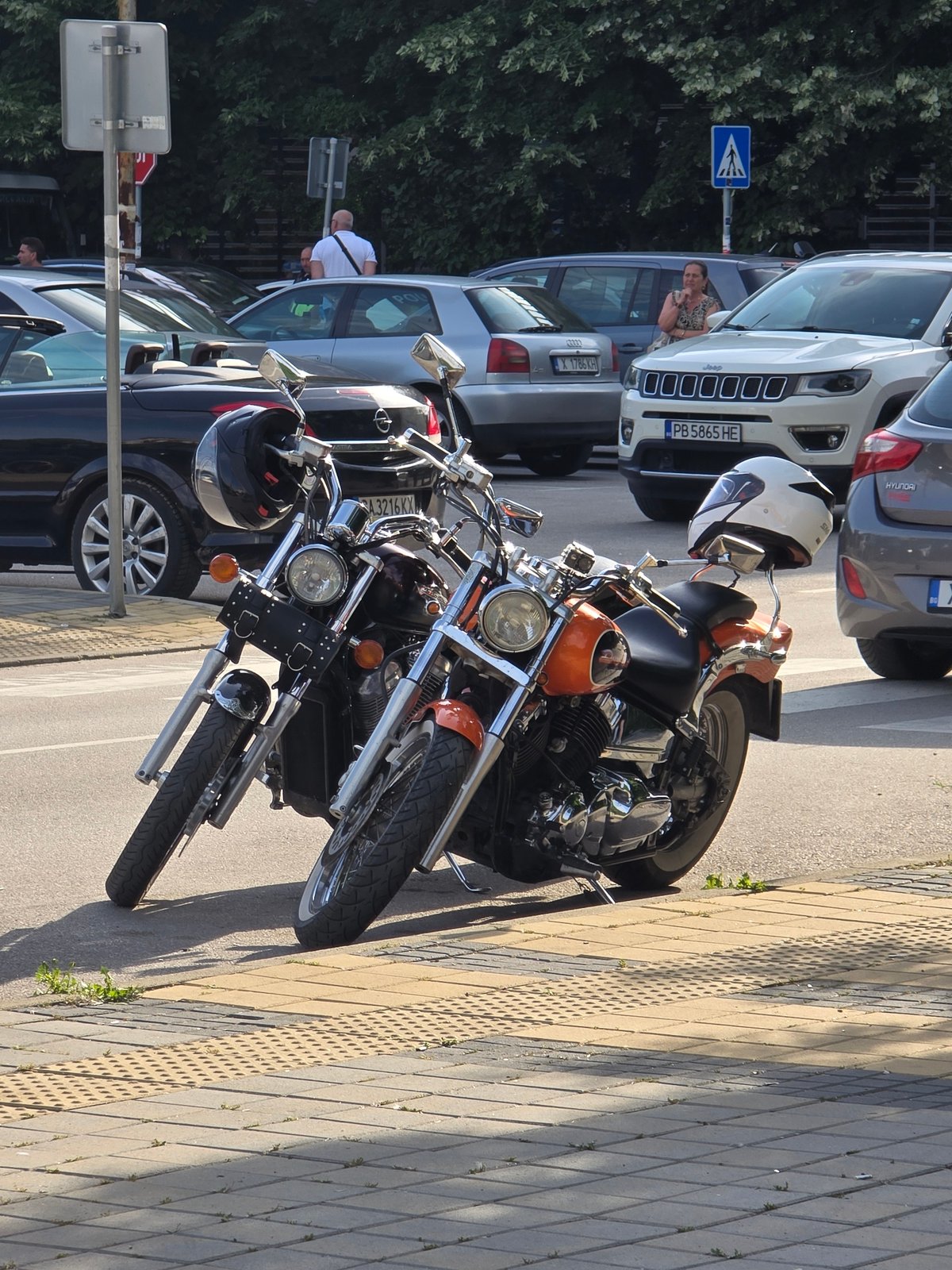 Urban scenes captured: motorcycles, heart locks, photoshoot, crowds, footpath