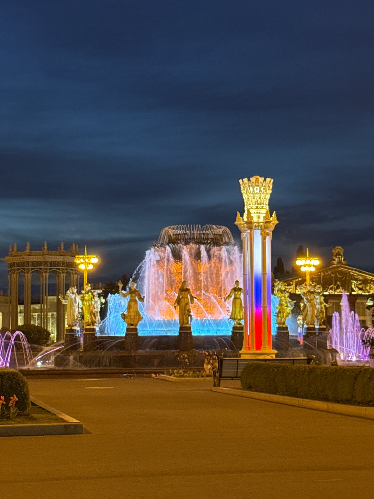 VDNKh and its famous fountain glowing on a Moscow evening