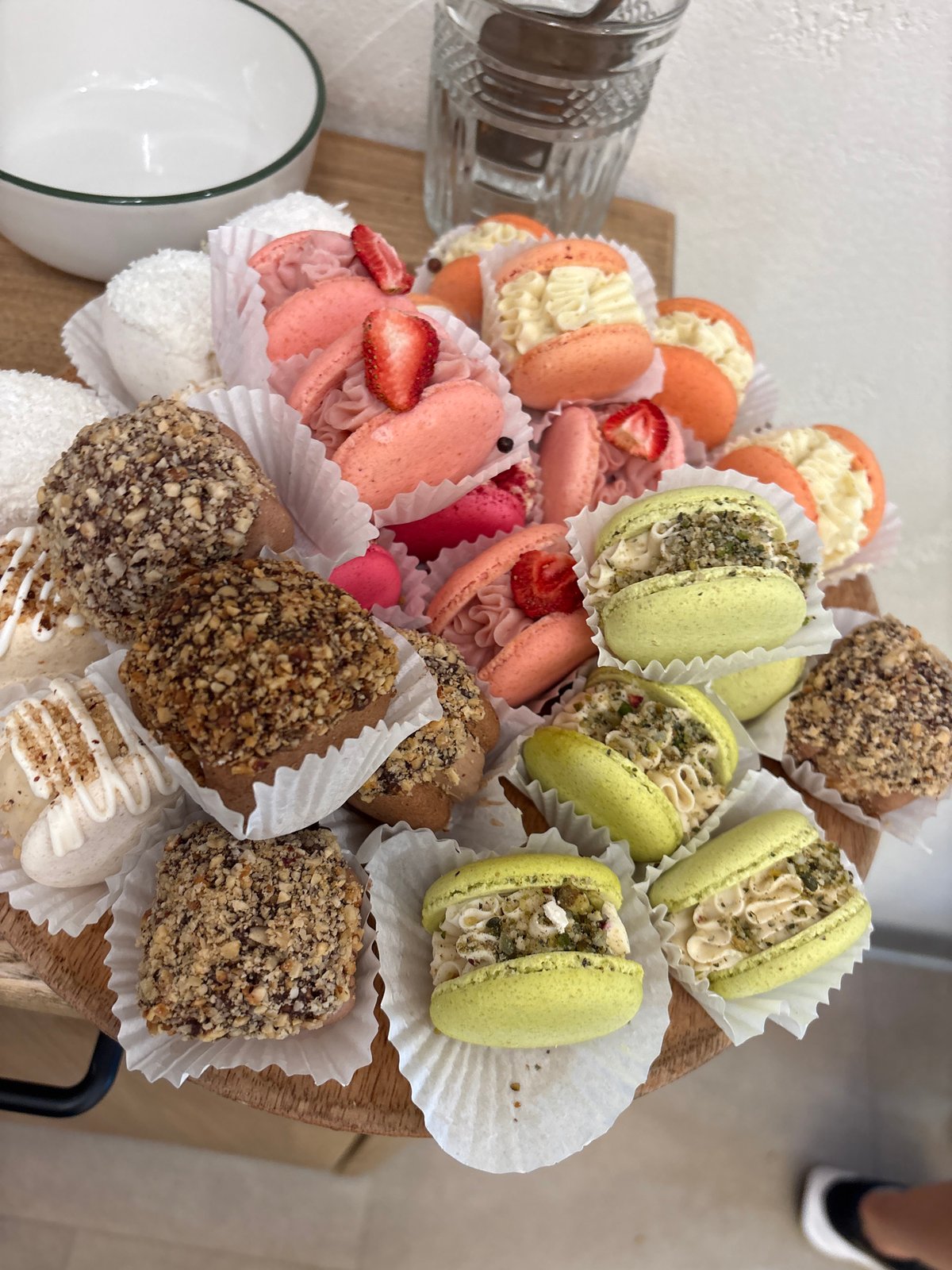 Close-up shots of café goods: macarons, coffee, and chilled drinks