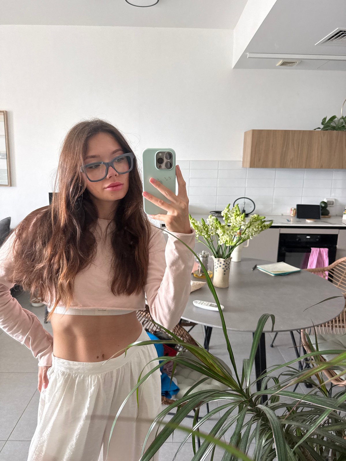 Indoor selfie session across kitchen and elevator locations