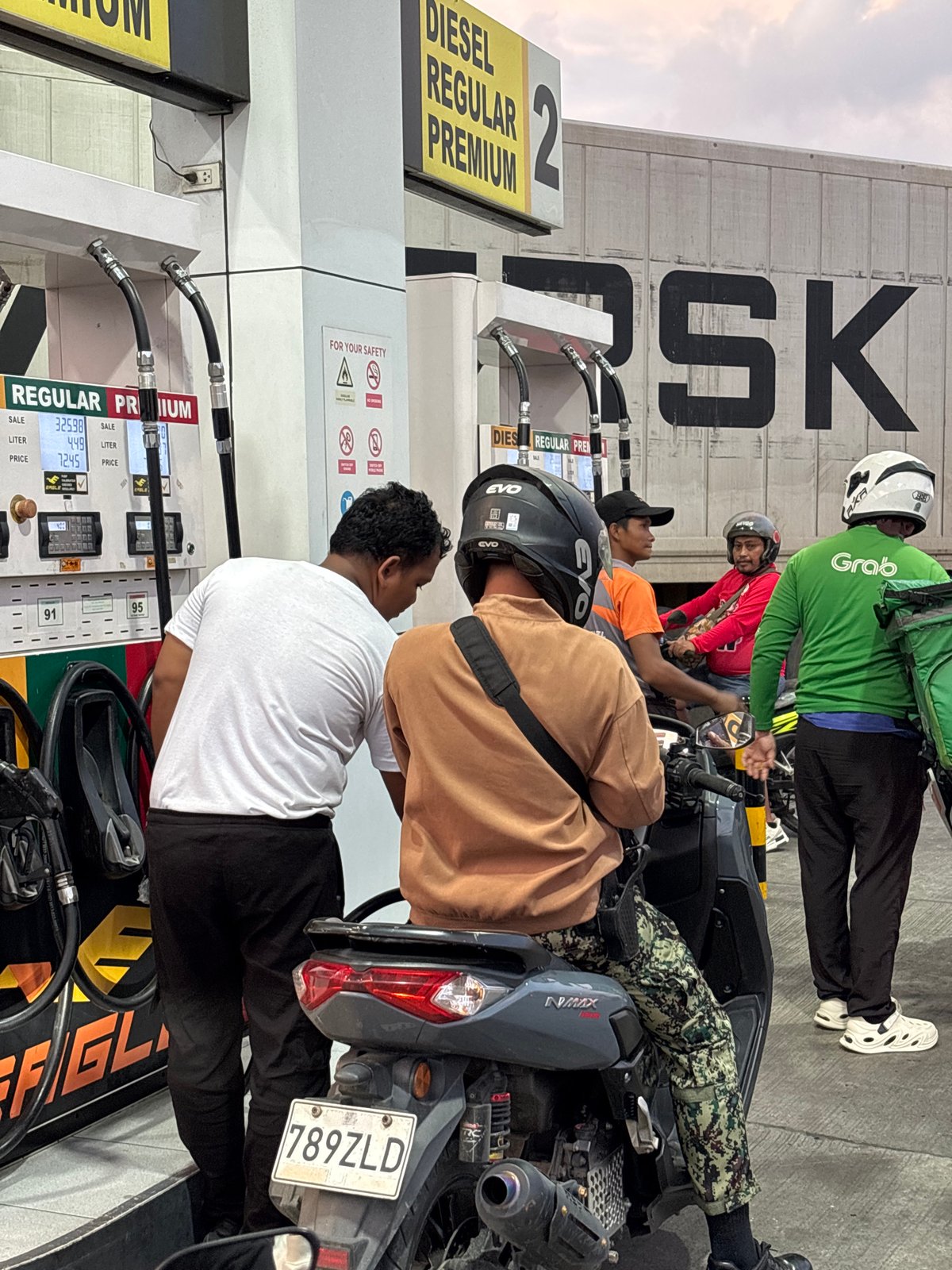 Evening motorcycle fuel stops documented across Davao City gas stations