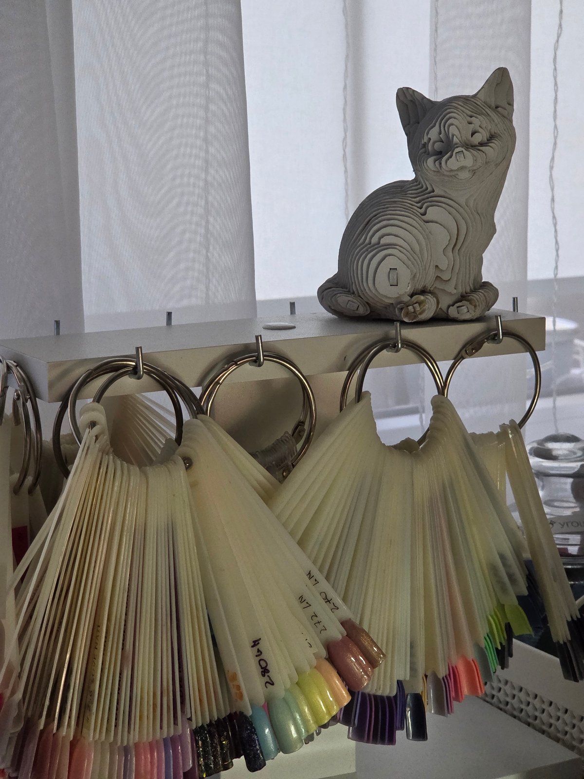 Nail salon manicure session documented with equipment and client