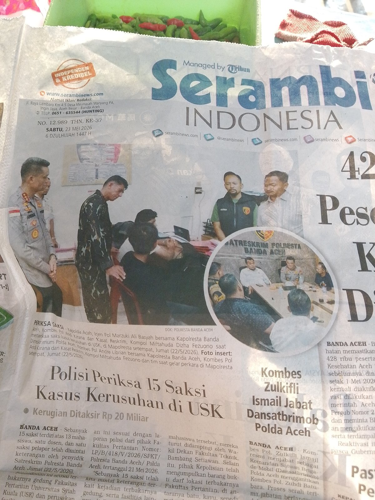 Morning life documented in Lhokseumawe: newspapers, food vendors, chilies