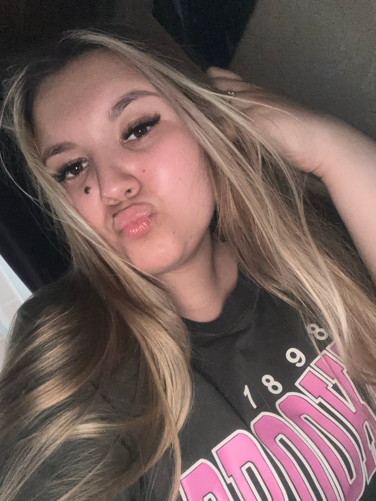Woman takes selfies in Russian village wearing Brooklyn shirt