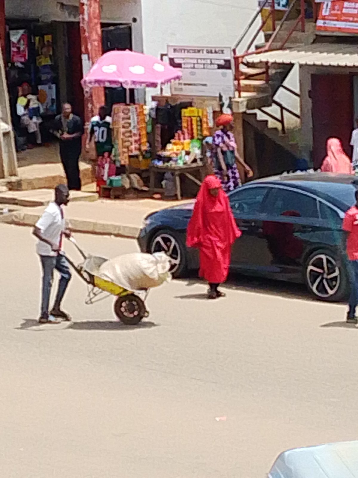 Urban marketplace bustles with vendors and daily commerce activities