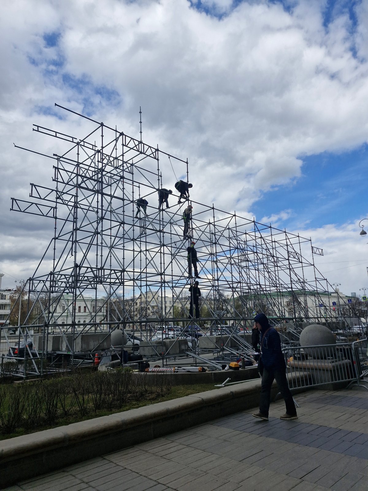 Workers active on metal scaffolding structure in Yekaterinburg