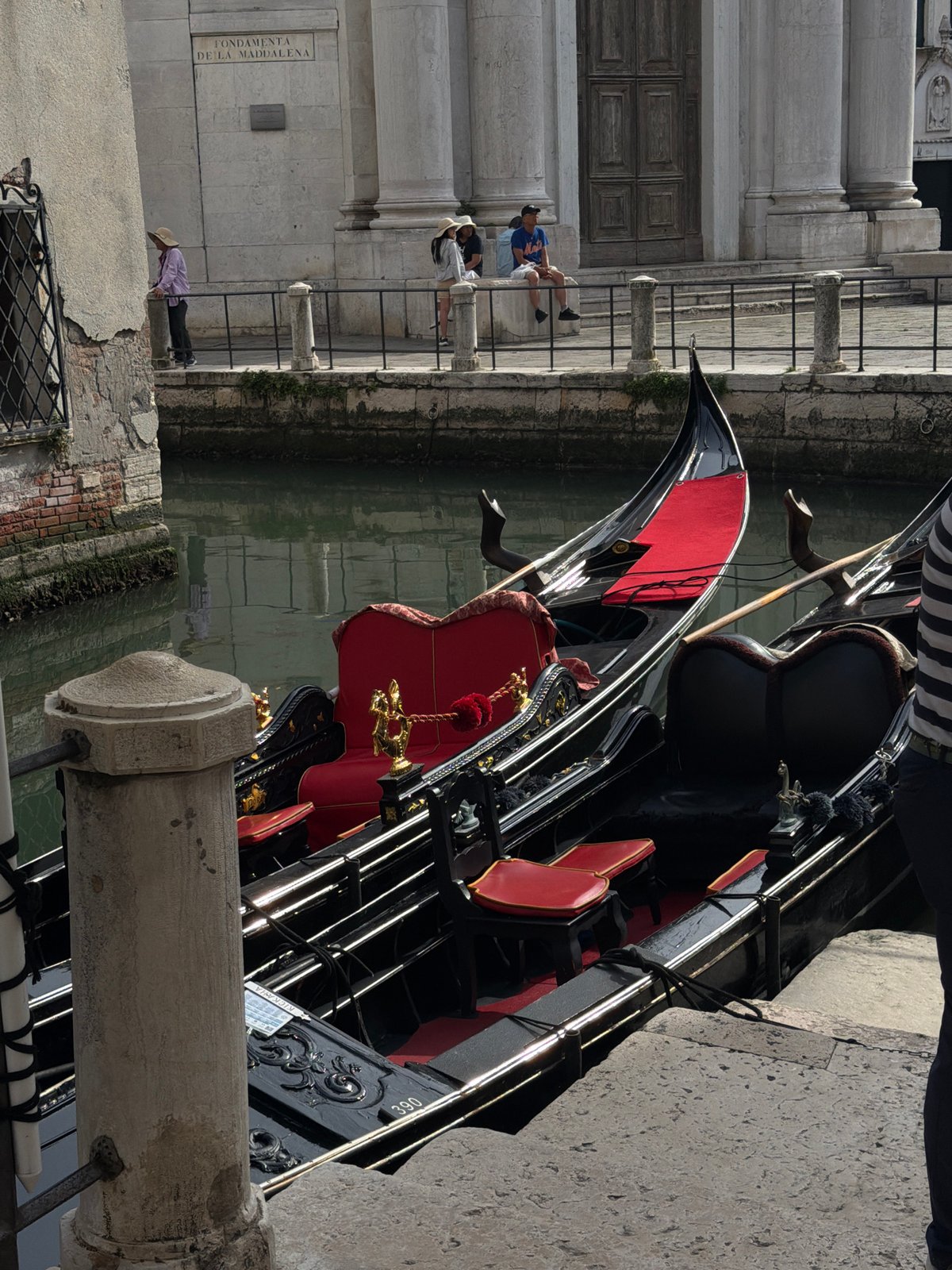 Venice canal walk with gondolas and classic architecture