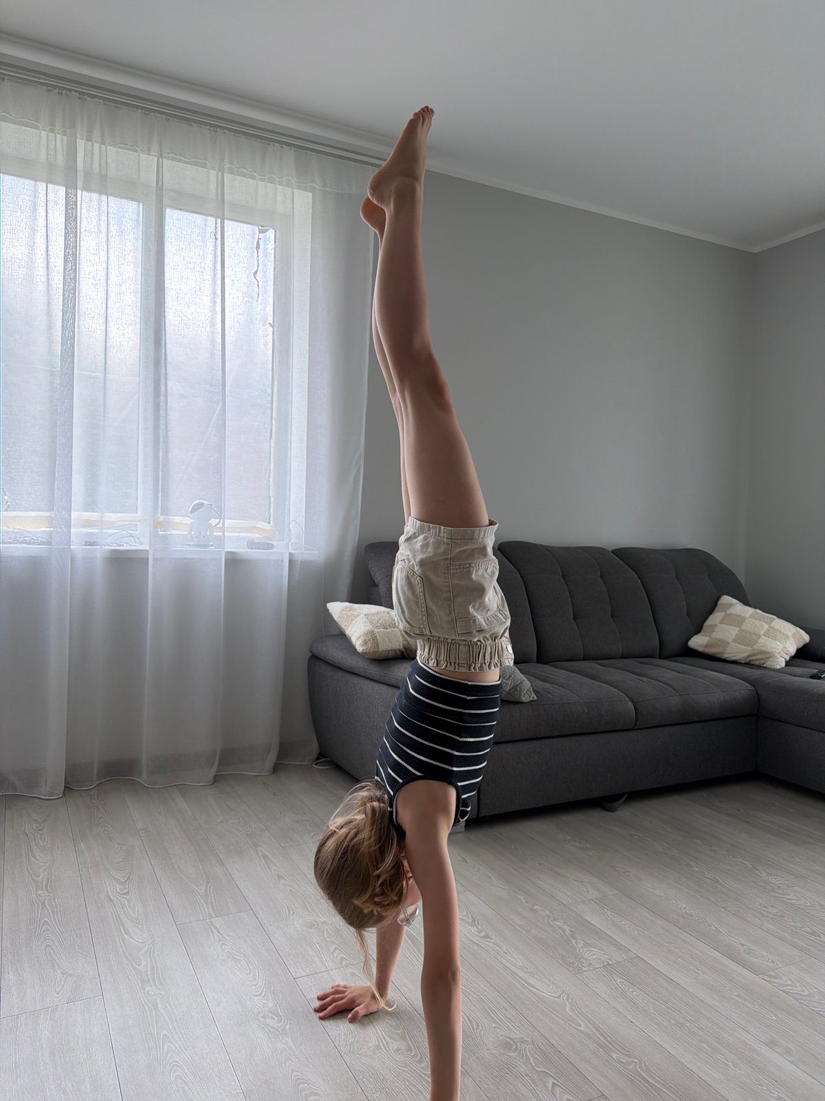 Woman practices yoga, handstands in Dreiliņi home