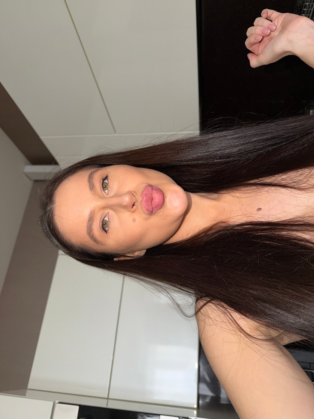 Woman takes mirror selfies in Khimki apartment