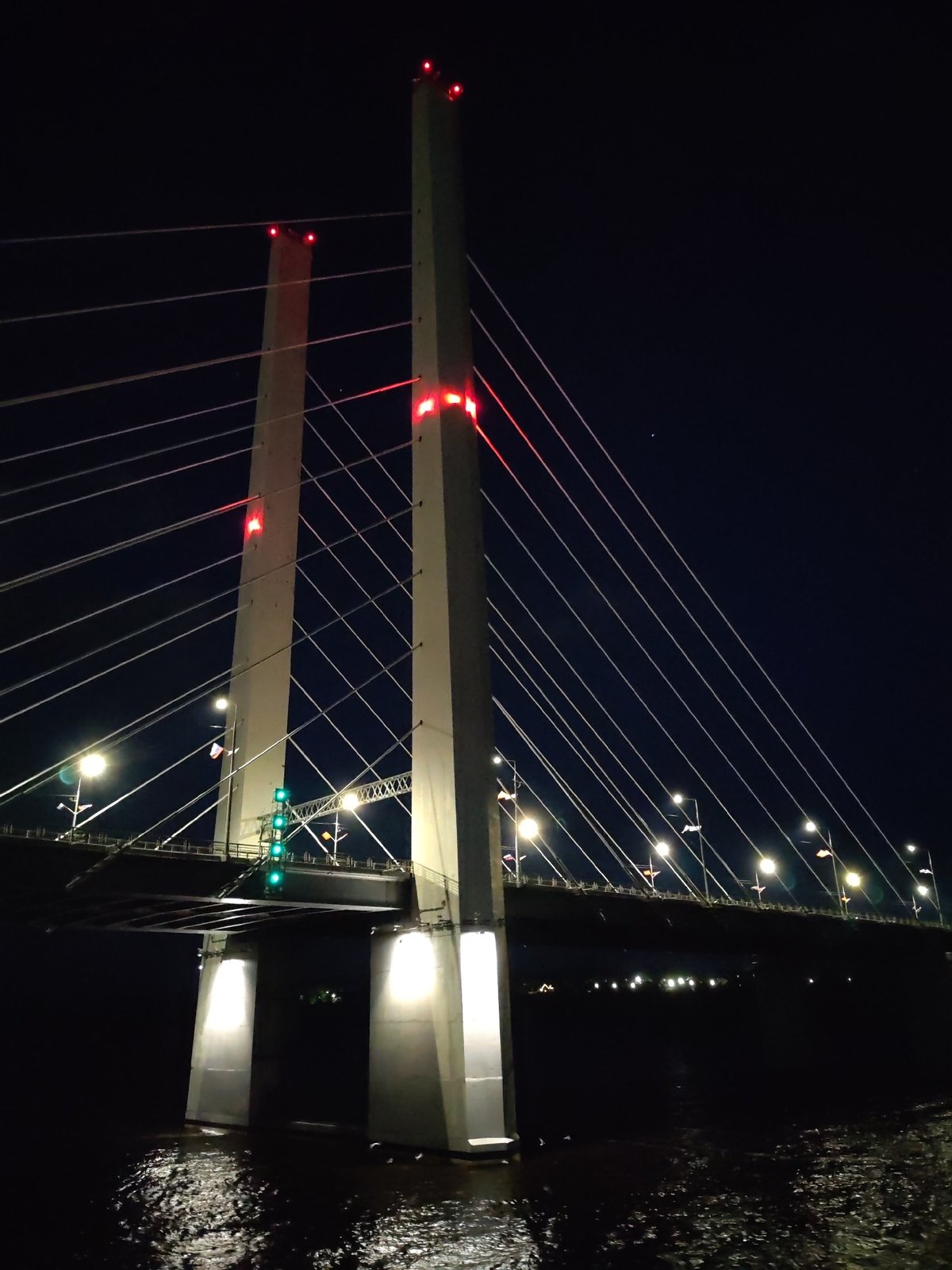 October Bridge illuminated at night in Cherepovets, Russia