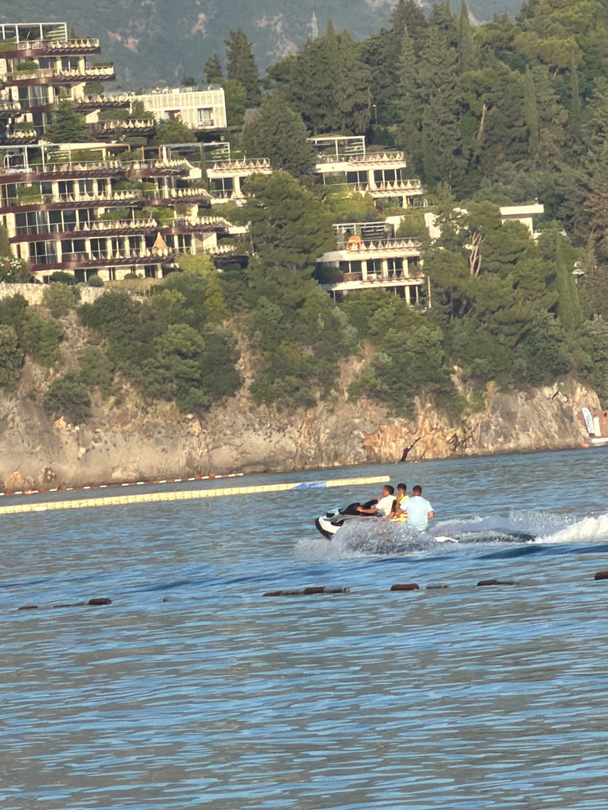 Jet skiers, boats enjoy calm waters off Budva coast