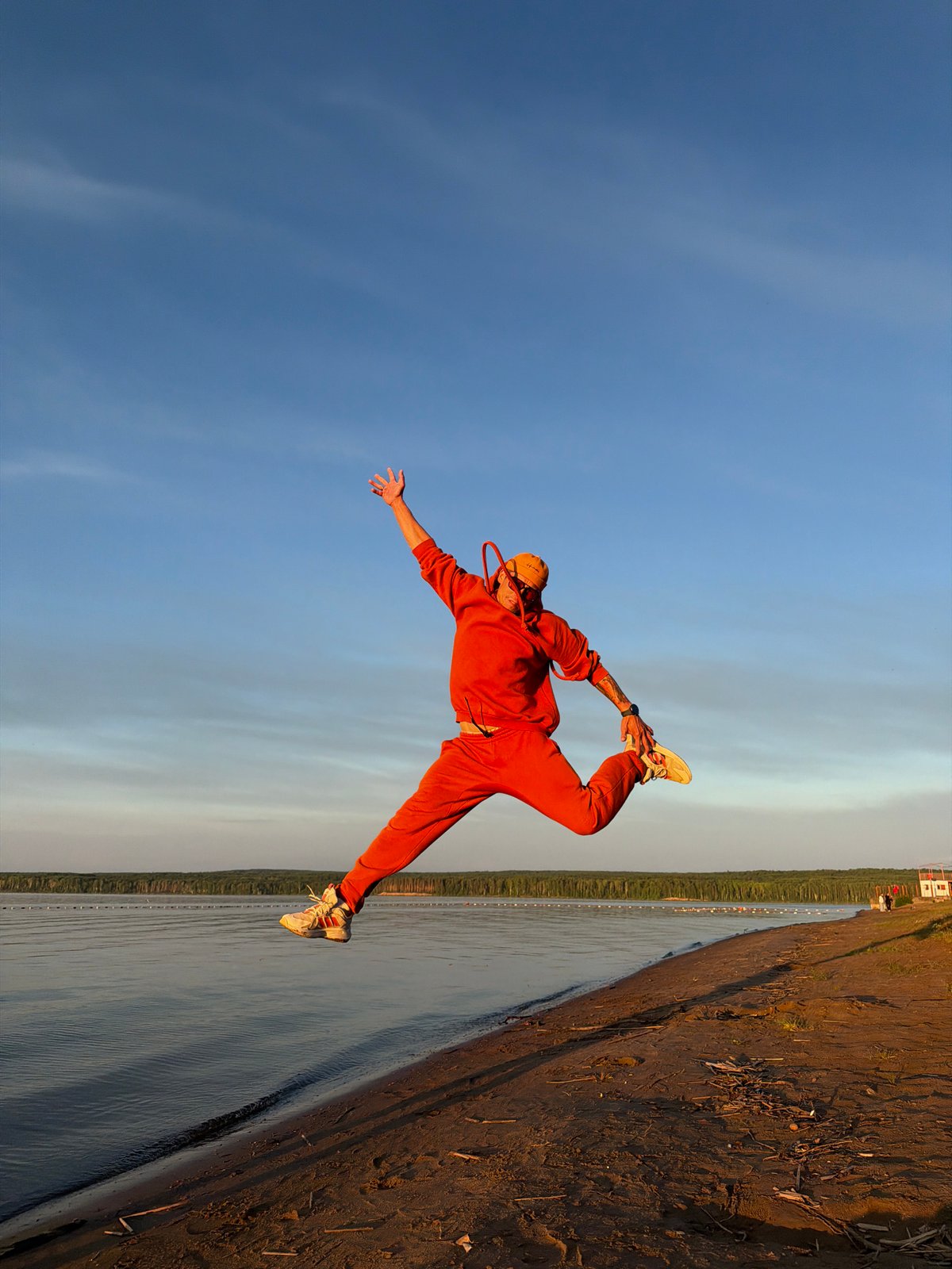 Sunset yoga session captured along Chaikovsky riverbank
