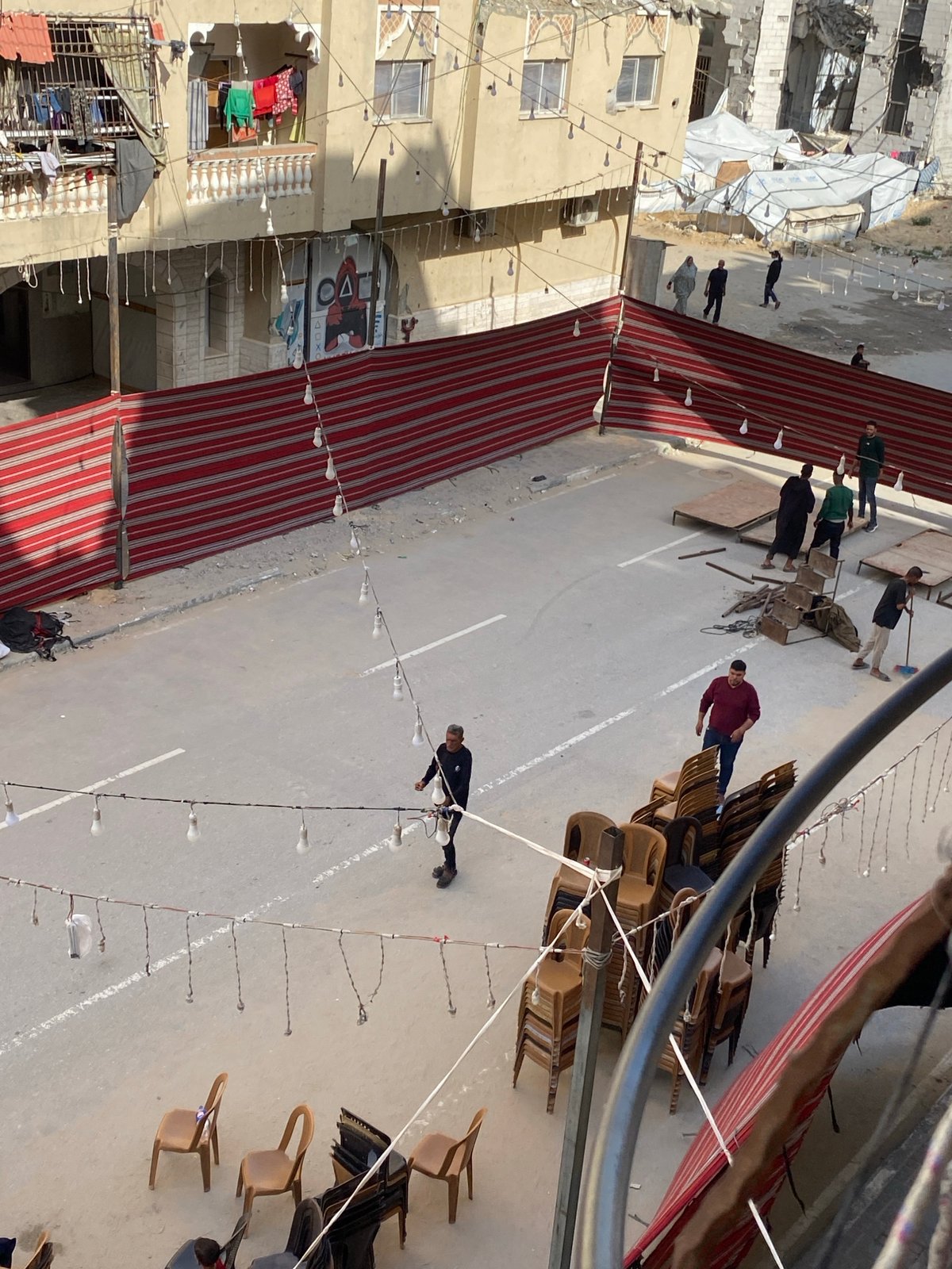 Community gathering documented in Khan Yunis street scene