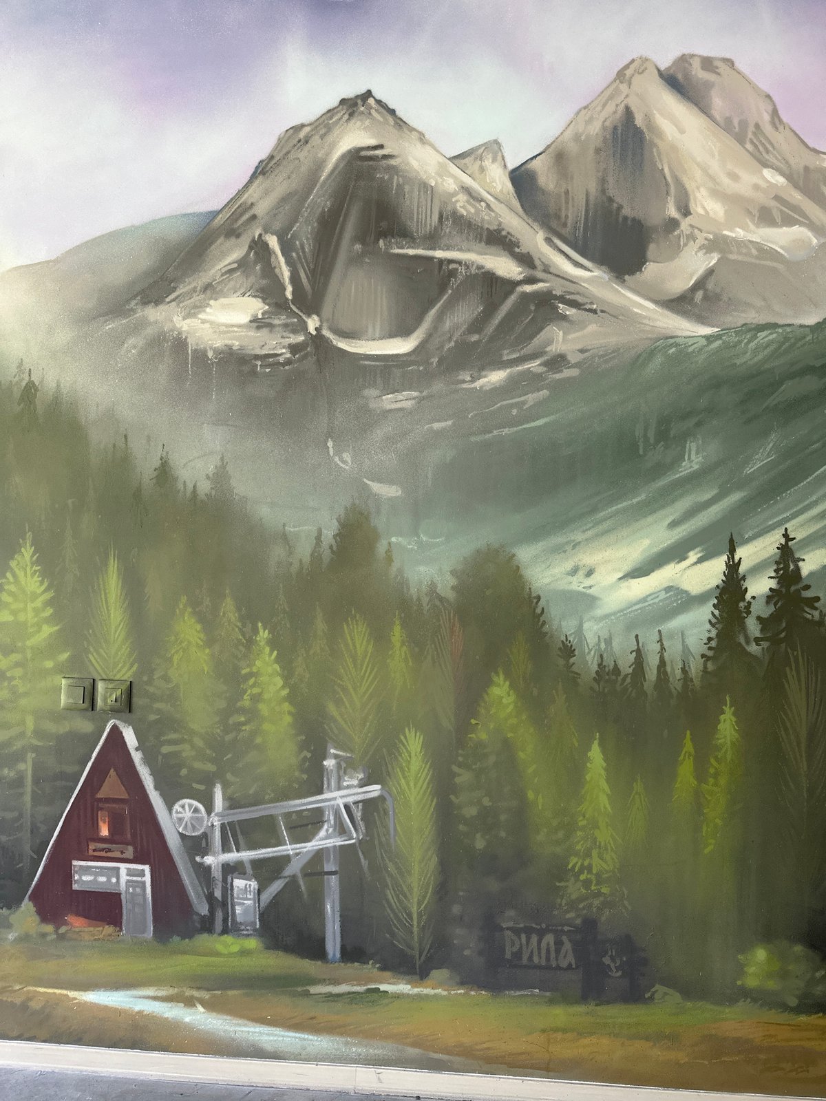 Mountain mural and forest road documented in same location