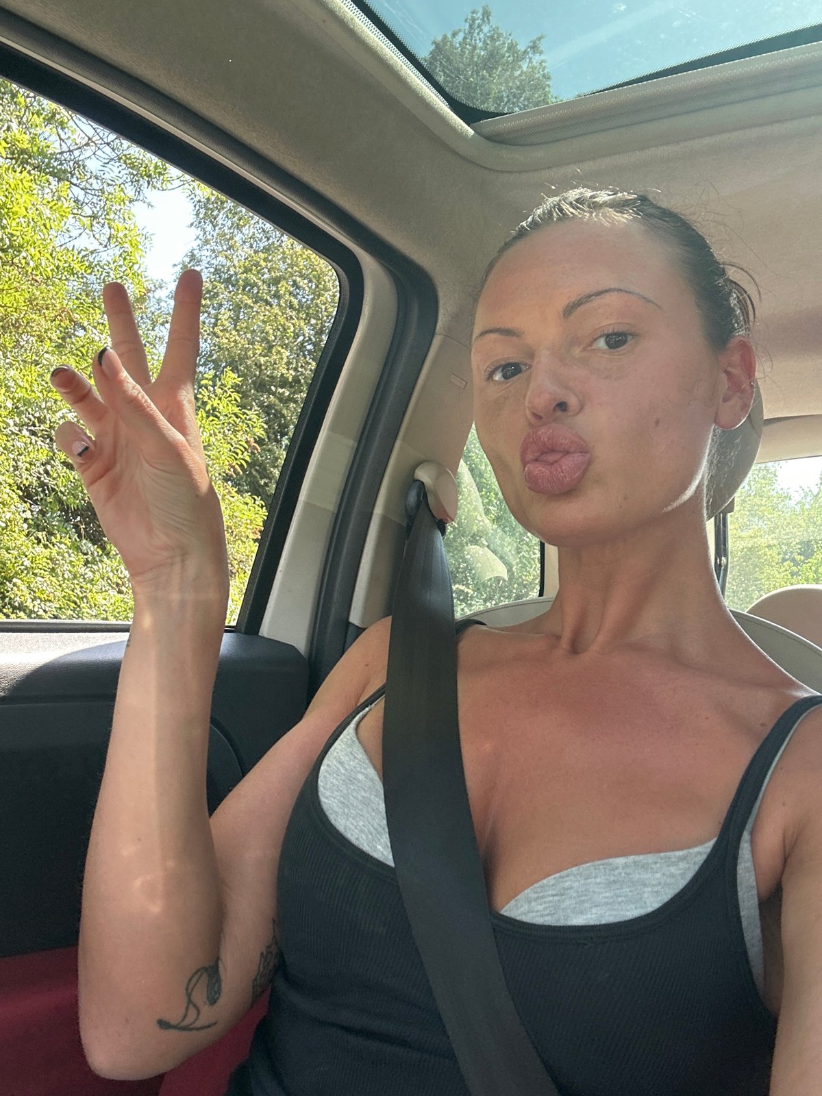 Woman takes selfie in car in Tunbridge Wells