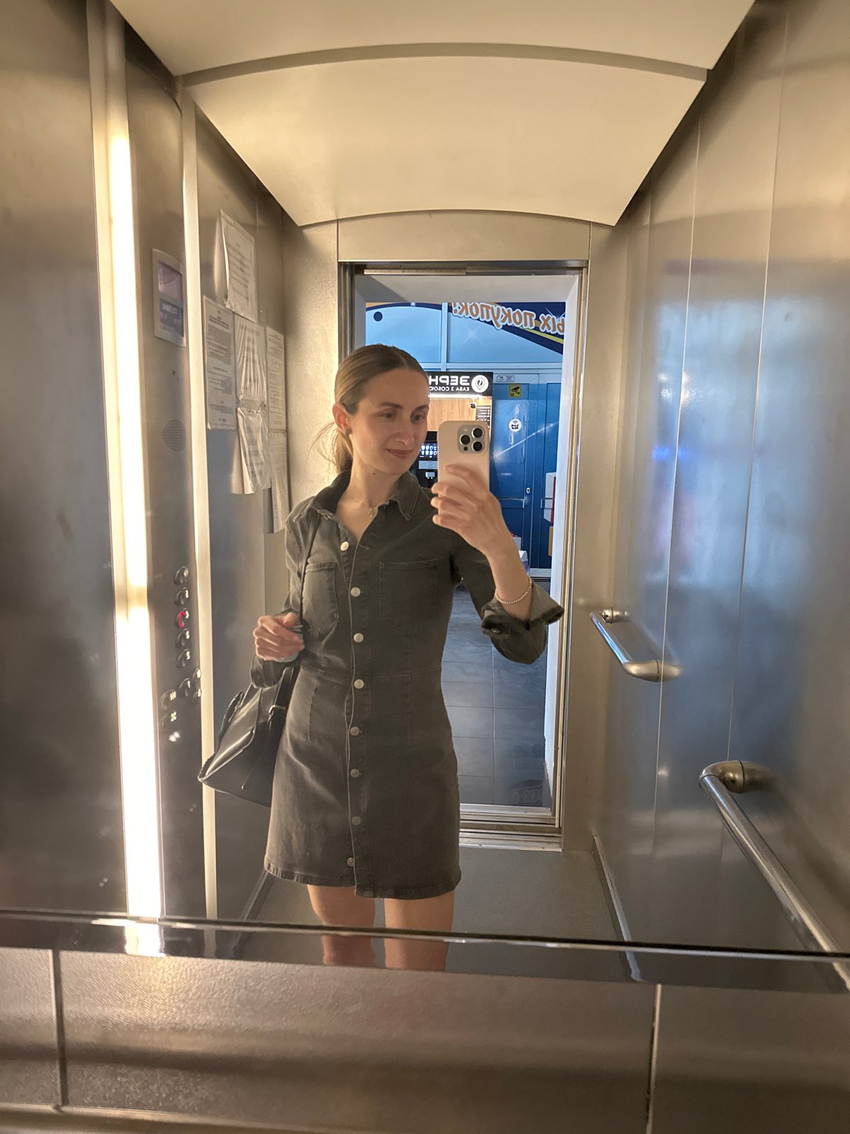 Woman takes selfie in apartment elevator in Kryvyi Rih