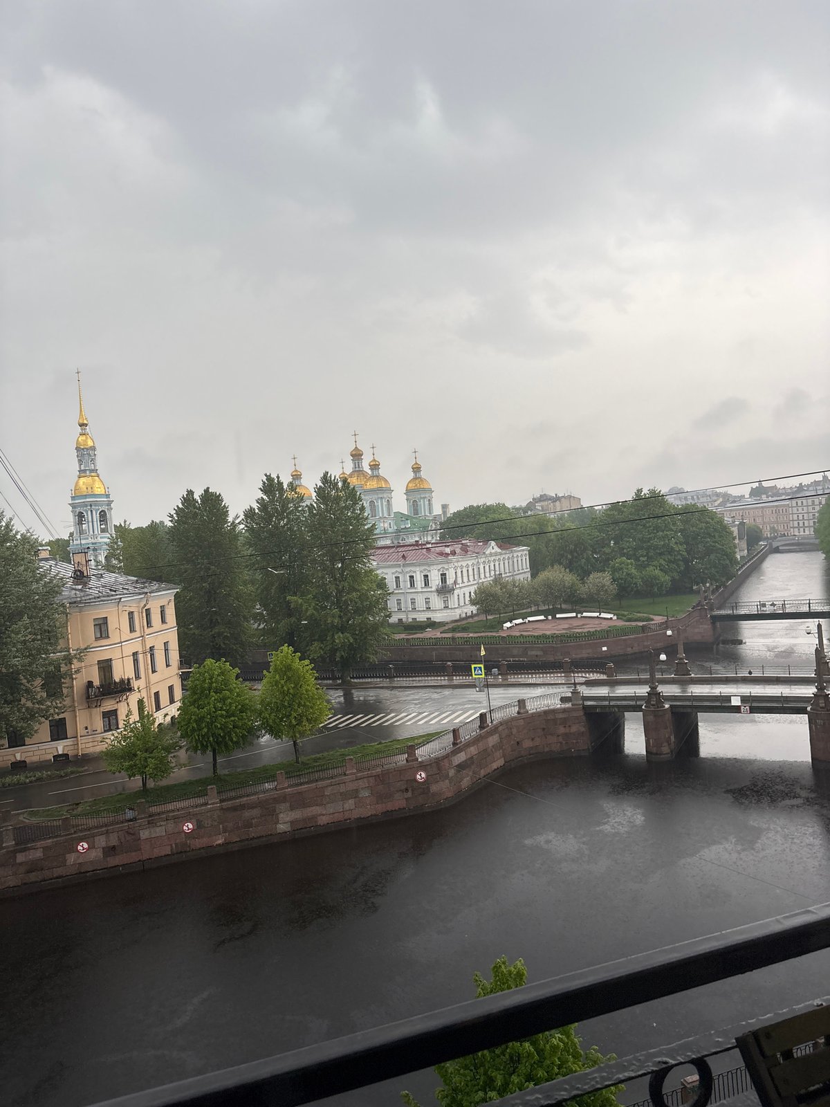 Woman documents morning routine amid overcast Saint Petersburg dawn